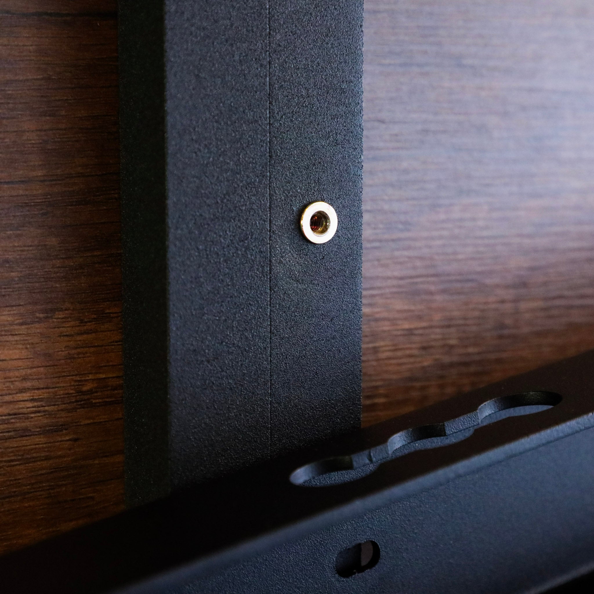 Close-up of Legless Bed Support System 2.0 by Storyteller Overland mounted to van wall panel