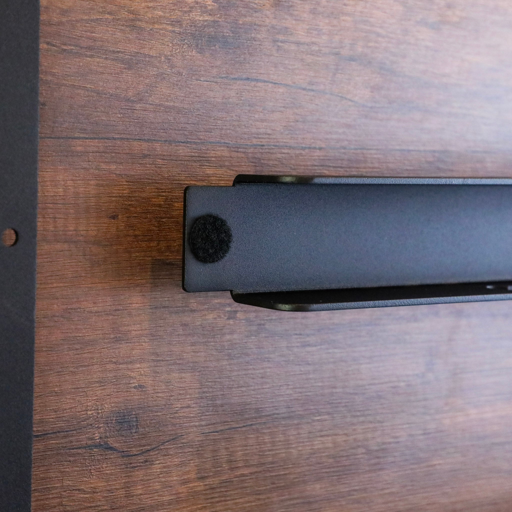 Close-up of Legless Bed Support System 2.0 by Storyteller Overland mounted on a wood panel