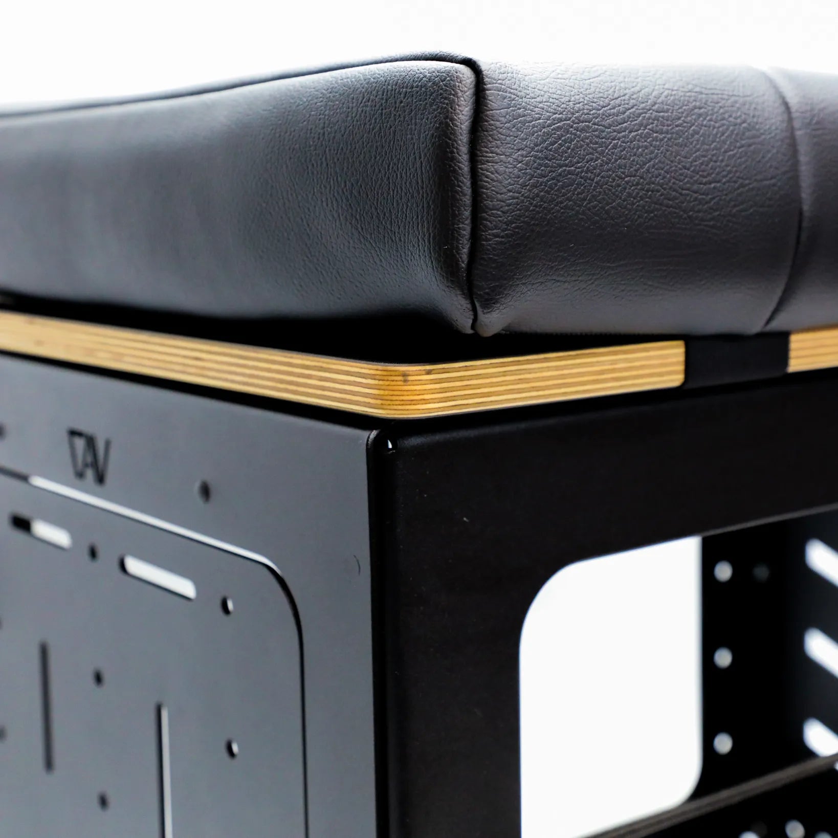 Close-up of the GLSS Pro bungee box driver seat with padded cushion and metal frame in a van.