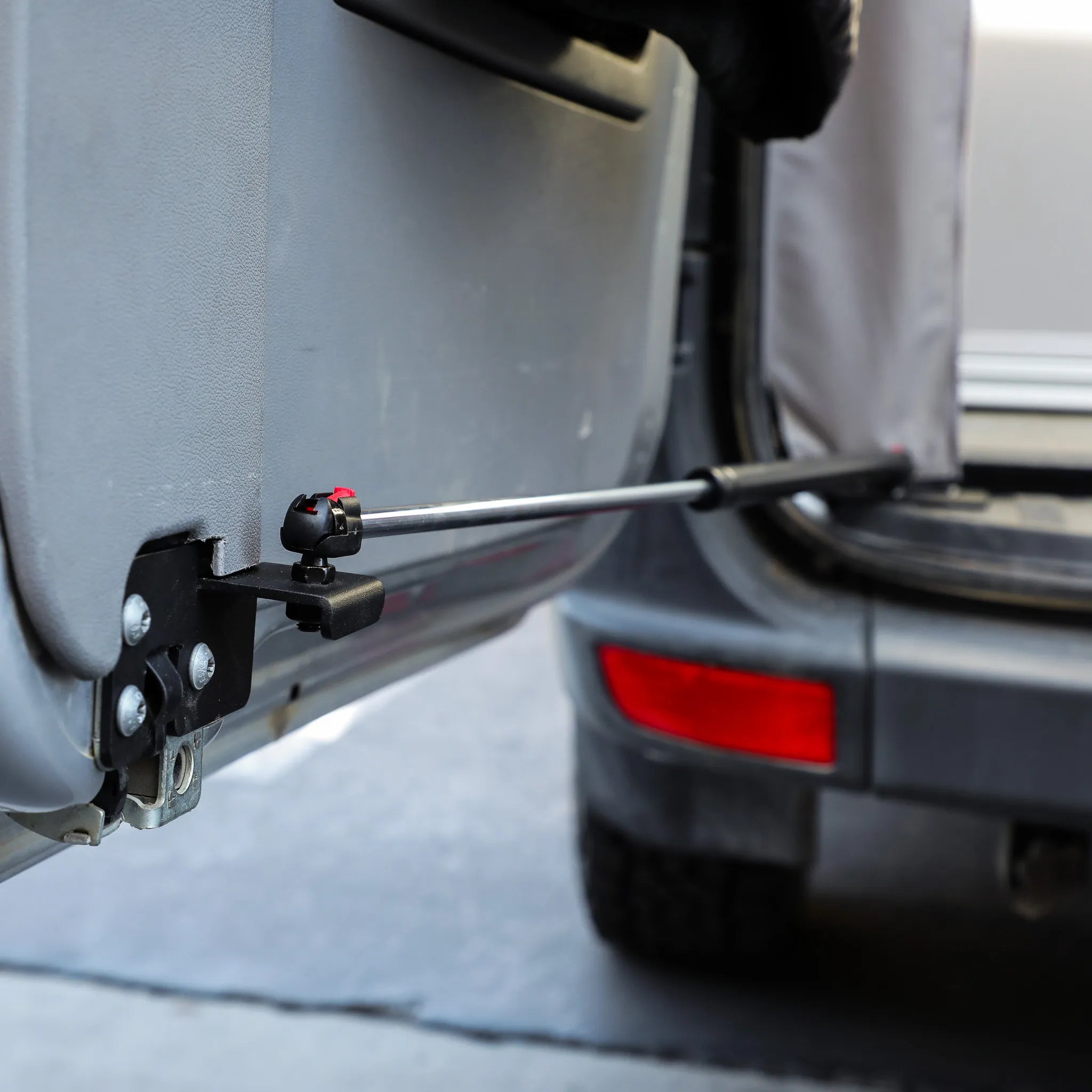 STOP-STAY door safety system installed on an open Mercedes Sprinter van door