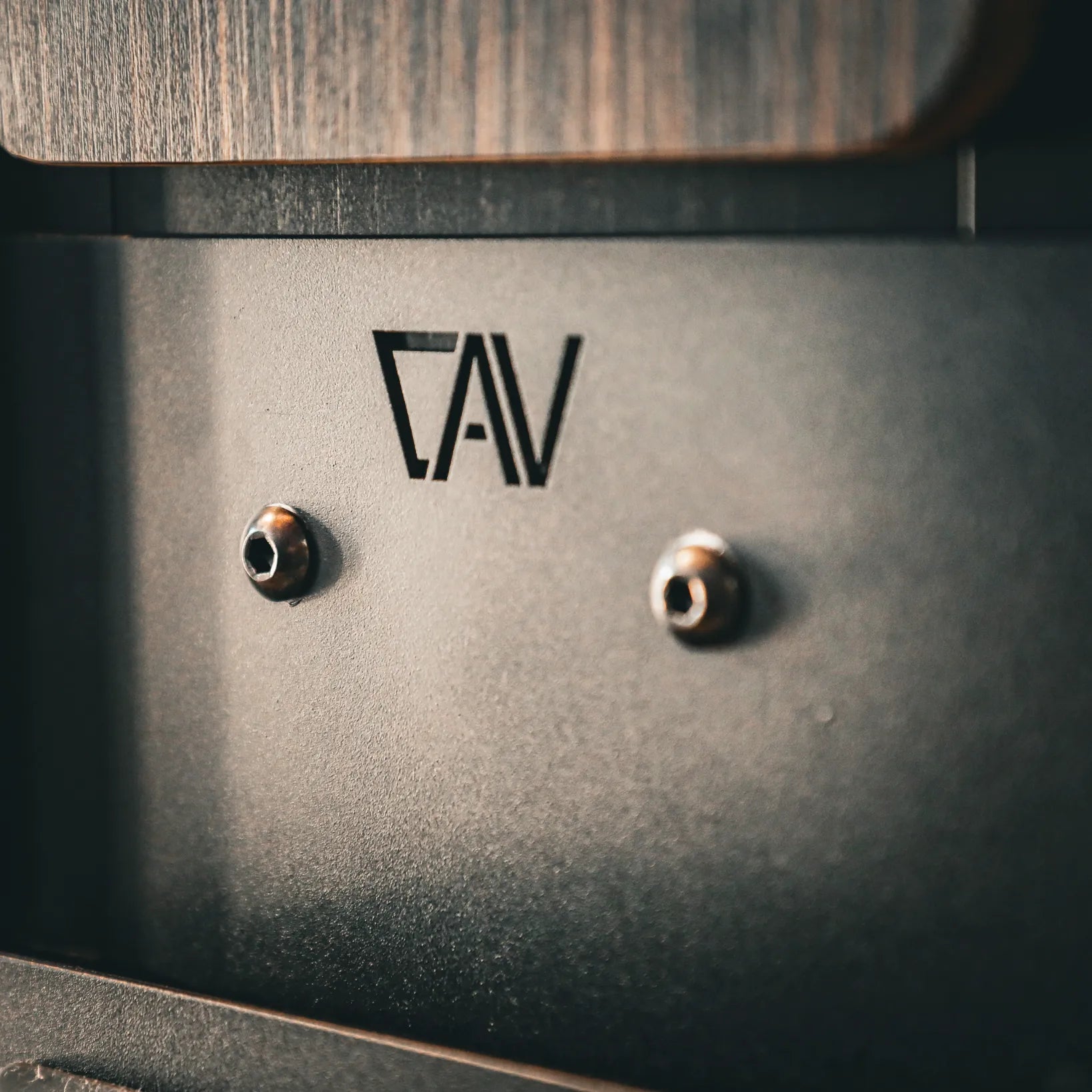 Close-up of CAV Folding Bed Step PRO installed in a Revel van interior