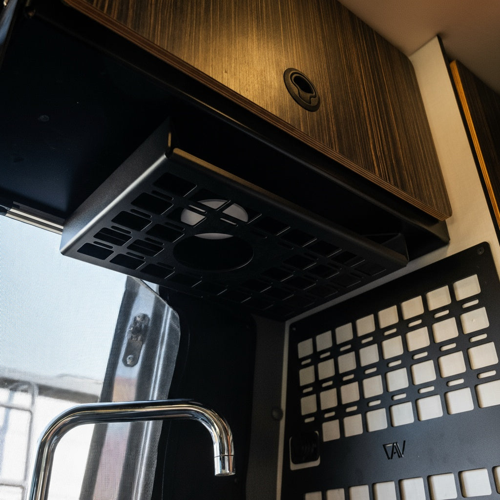 Revel undercabinet shelf mounted above sink area inside van kitchen.