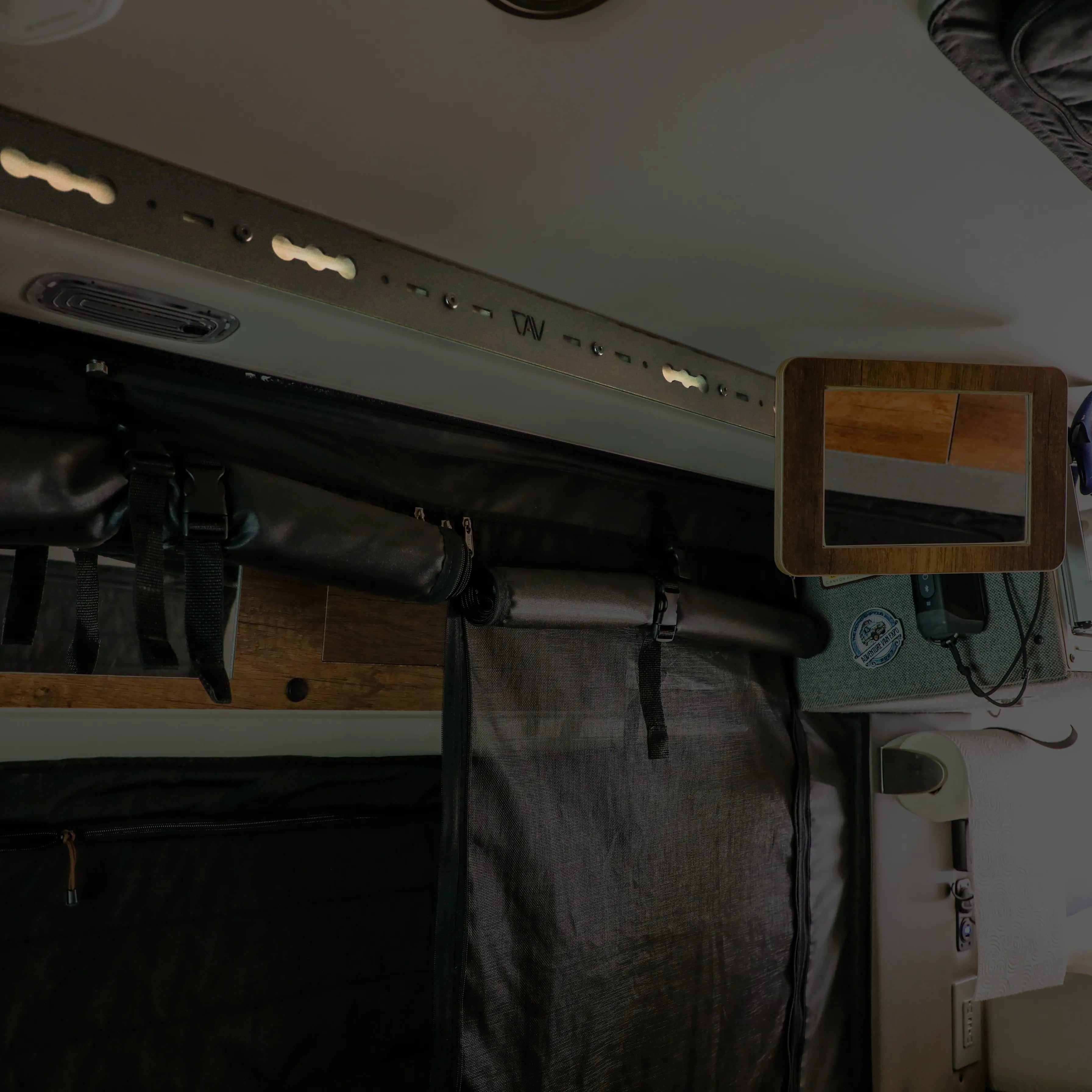 L-Track Pro installed on van ceiling for overhead sliding or rear doors in Storyteller Overland Mode van.