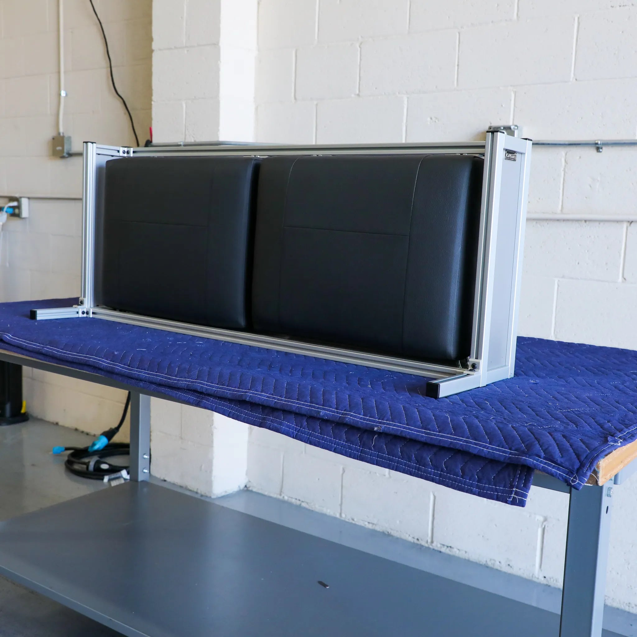 CSS-R countertop seating system for Revel model, shown from front view in black.