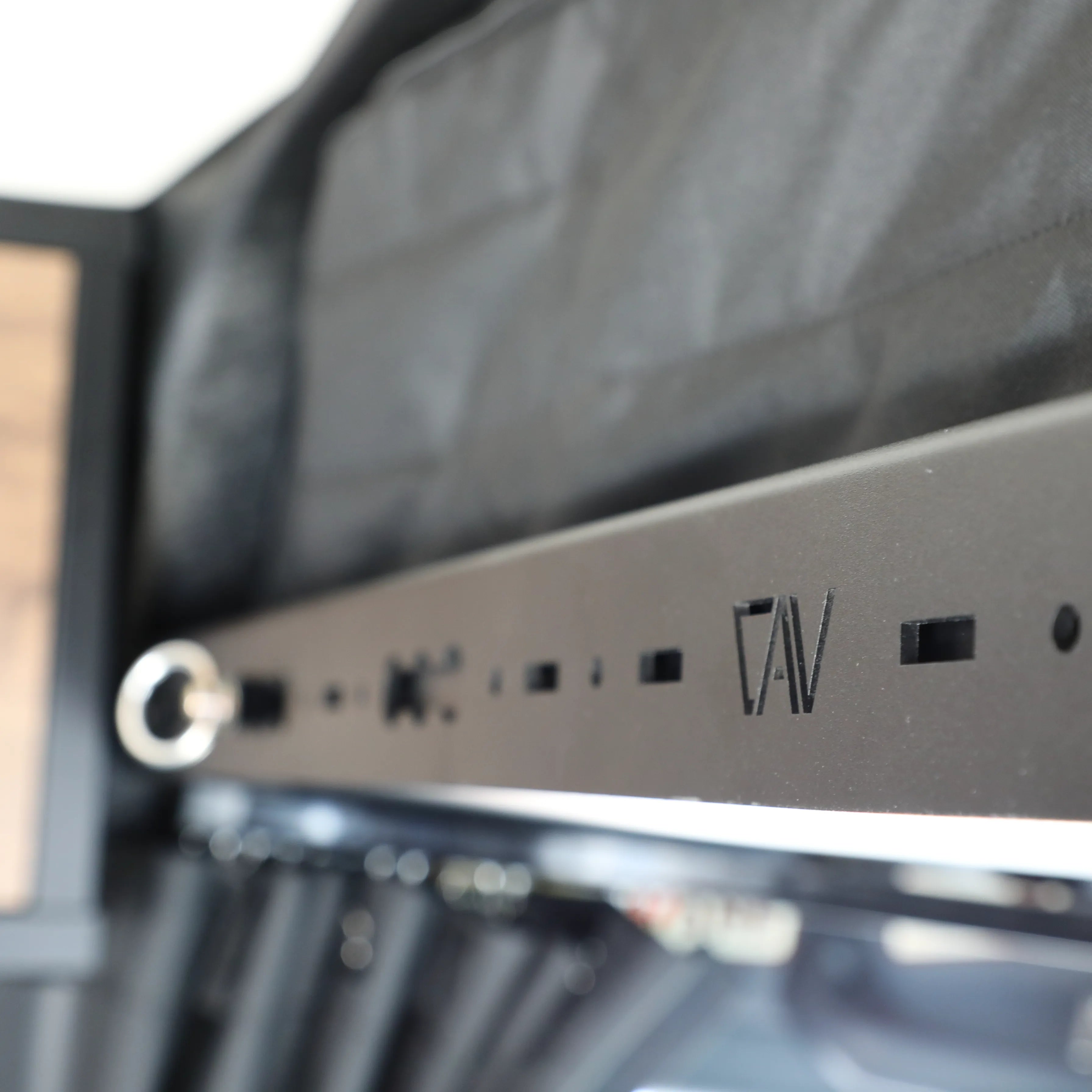 Close-up of CAV Headliner Shelf installed in a Storyteller Sprinter van interior.