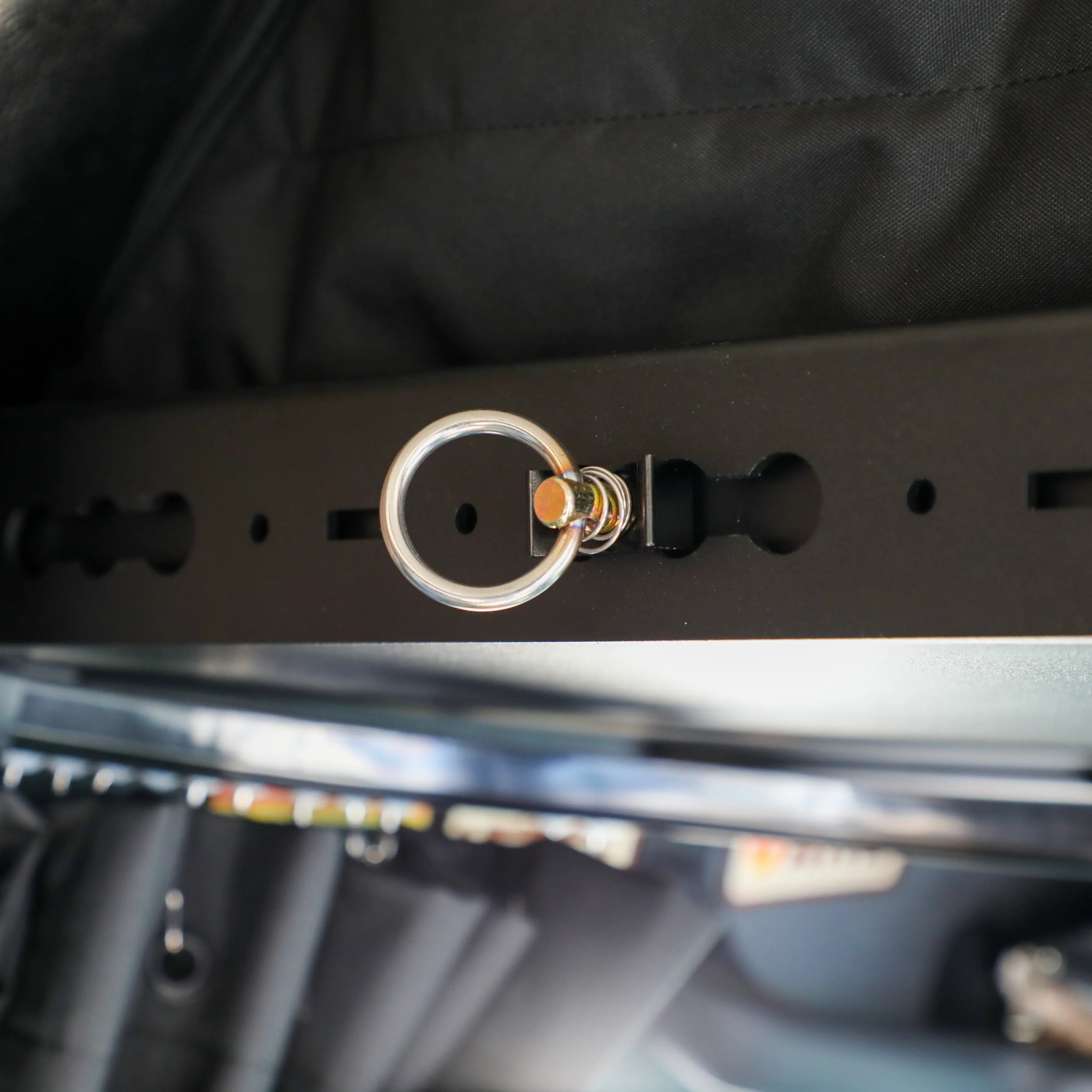 Close-up of Headliner Shelf Bundle installed in a Storyteller Sprinter van with mounting ring detail visible.