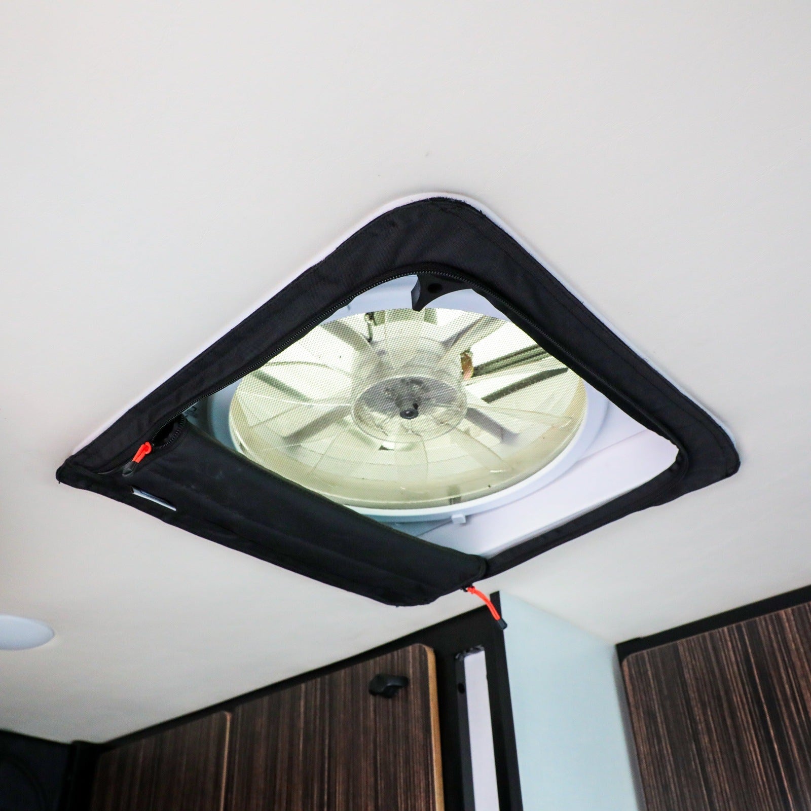 Ultimate CLIMA-SHADE bundle by Revel installed on a ceiling fan vent in a van interior.