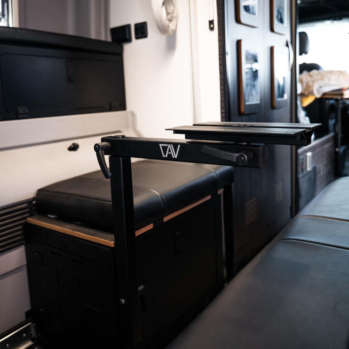CAV Canyon Table Leg System mounted in van interior with raised tabletop arm extended