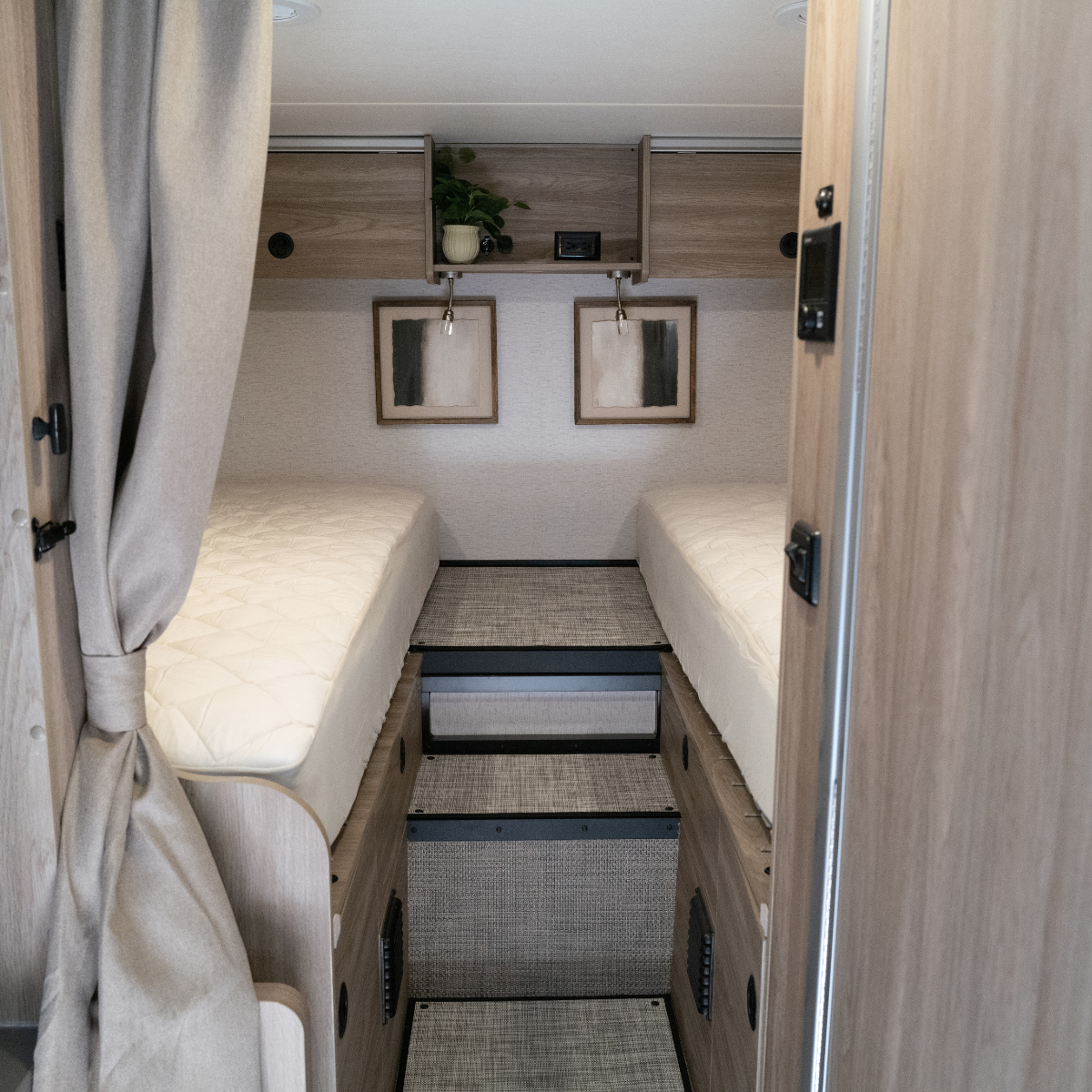 Twin ULTRA Luxe mattresses in rear Winnebago Ekko van with wood cabinets and step access