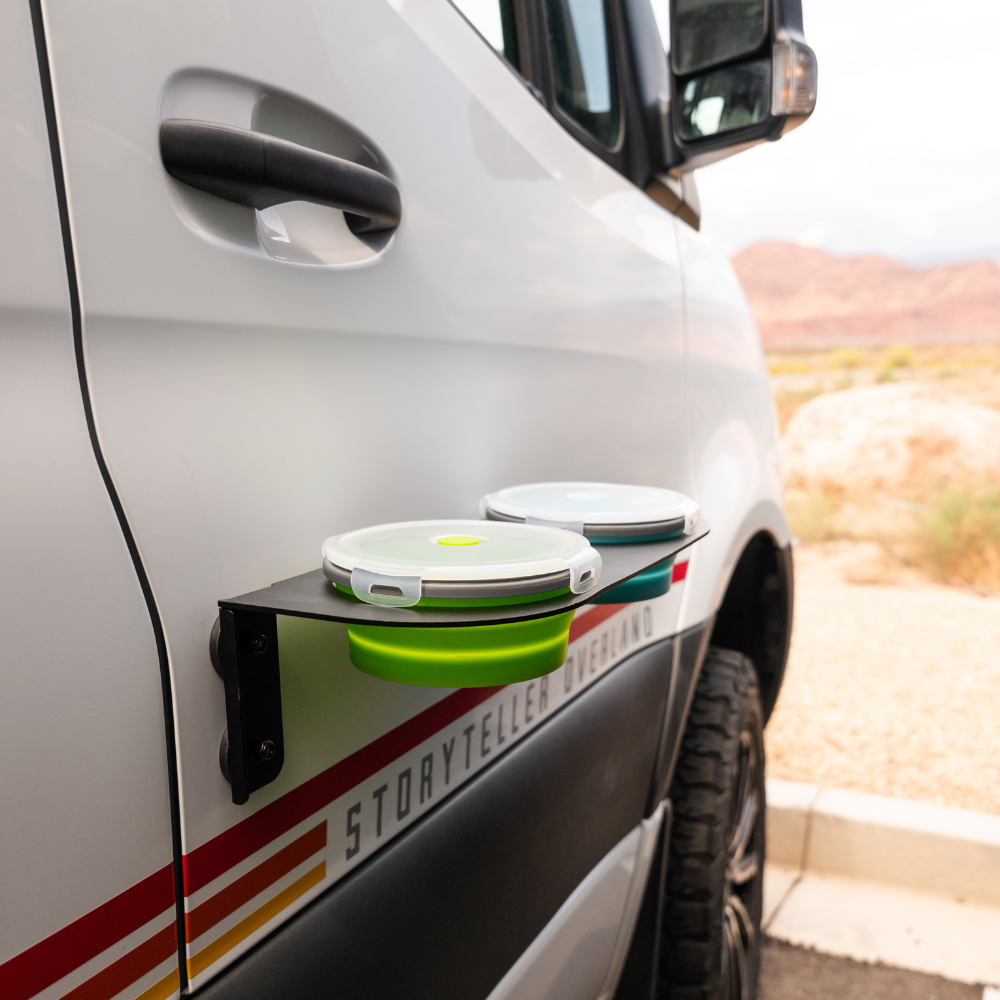Storyteller Canyon Pet Bowl set mounted on van exterior with collapsible bowls extended
