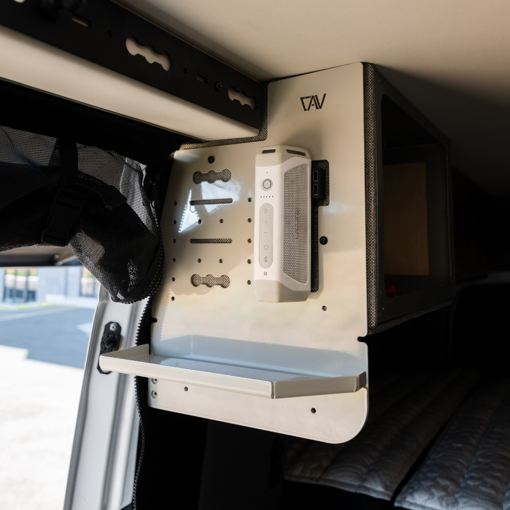 CAV Canyon Kitchen Caddy mounted inside a Storyteller van with storage shelf and speaker dock.