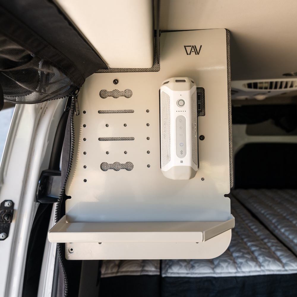 CAV Canyon Kitchen Caddy by Storyteller mounted in van with folding shelf and gear storage slots.