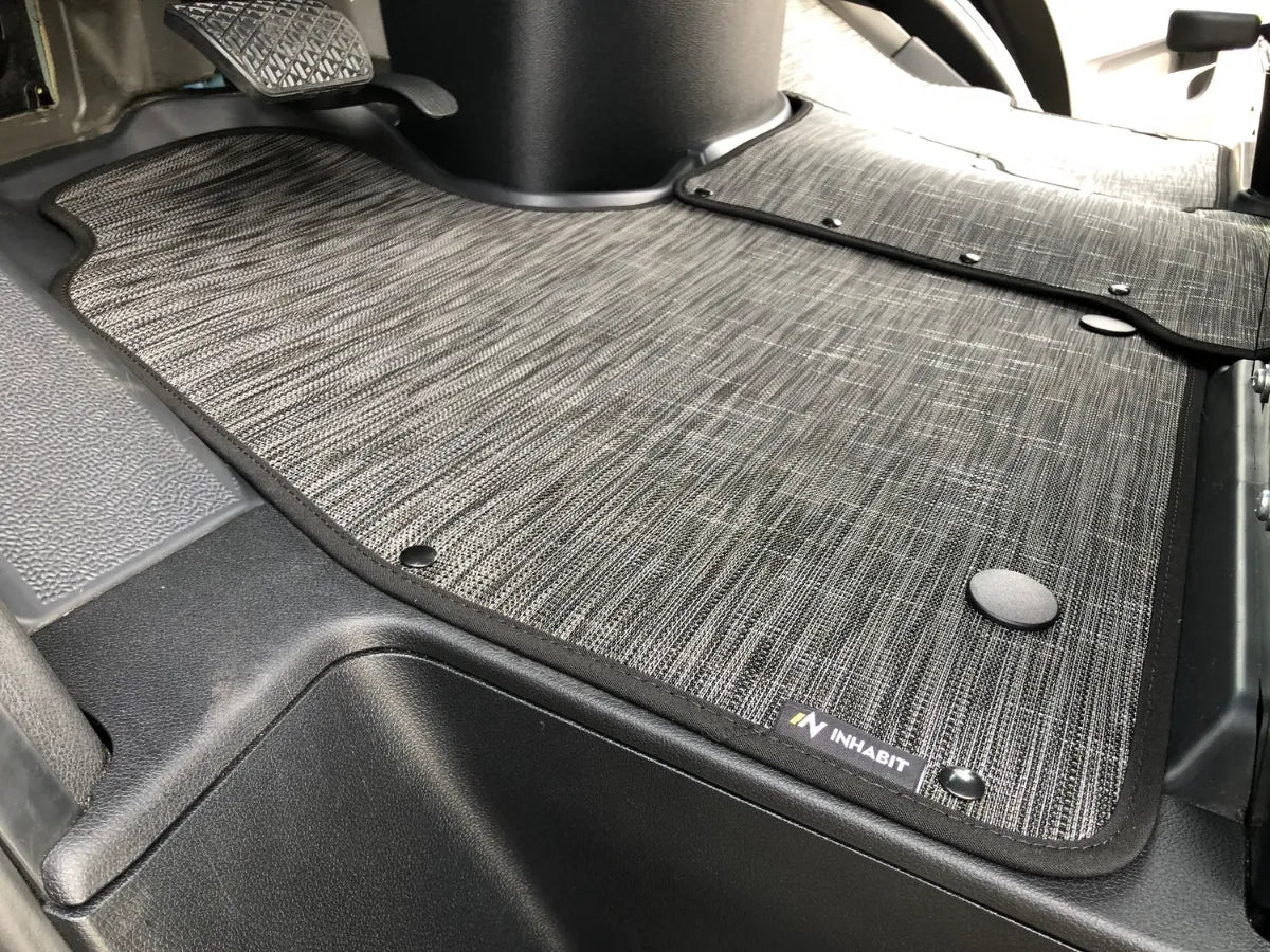 Floor mat system for the 2025 Ekko Sprinter Chassis, shown in a Canyon vehicle interior.