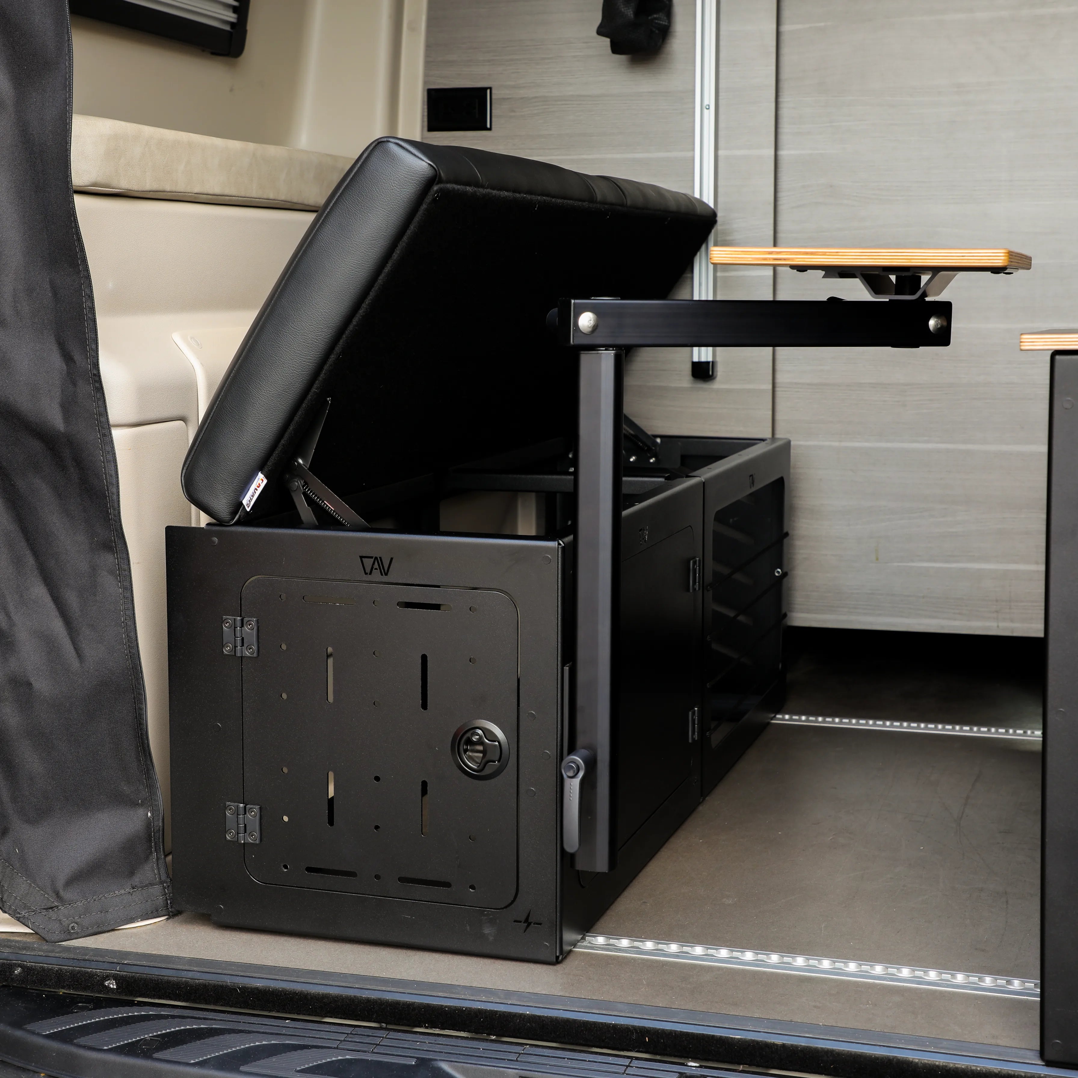 GLSS Driver PRO bungee lounge storage system open inside a van with seating and cabinet space visible.