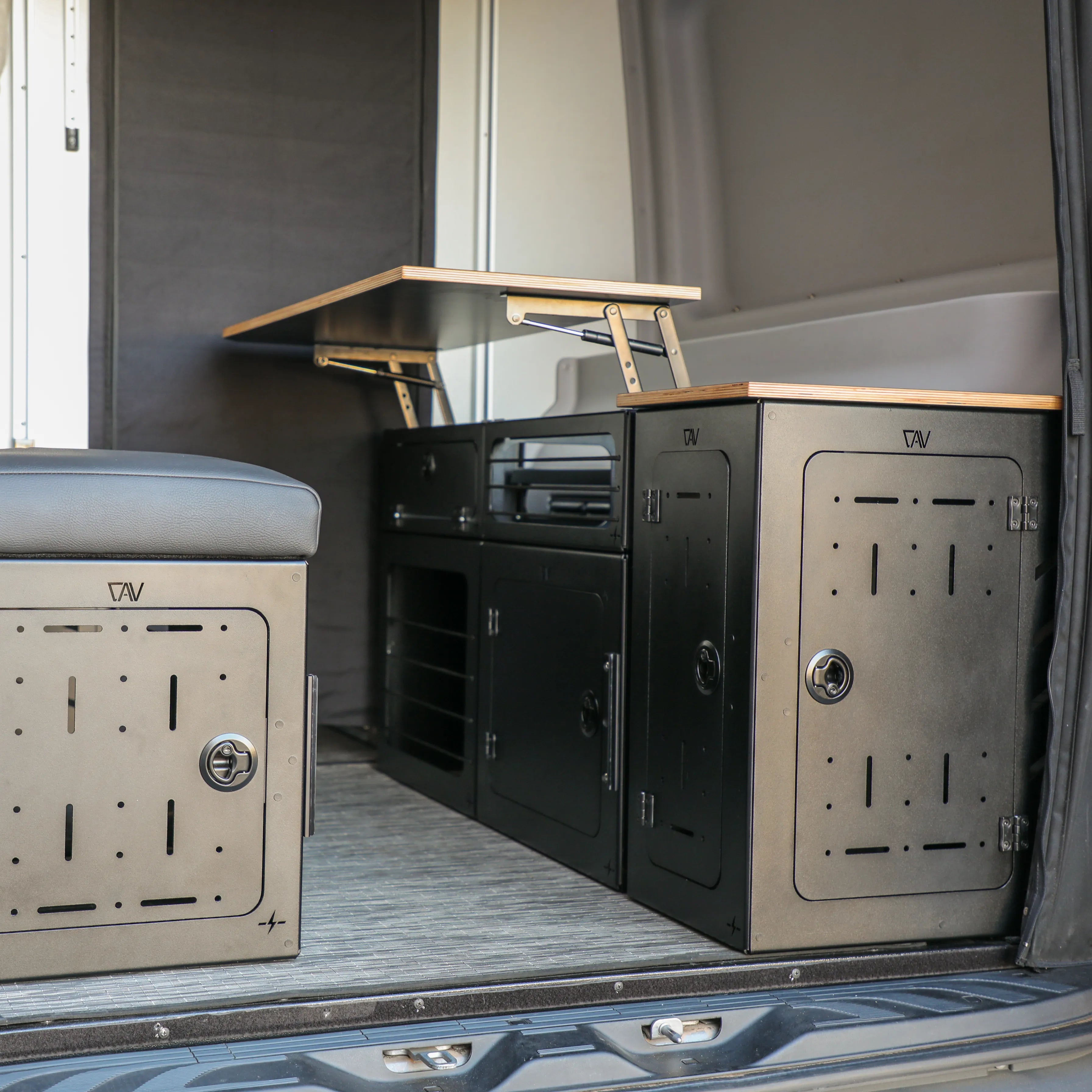 GLSS PRO storage system set installed in van with fold-out table and black metal cabinetry