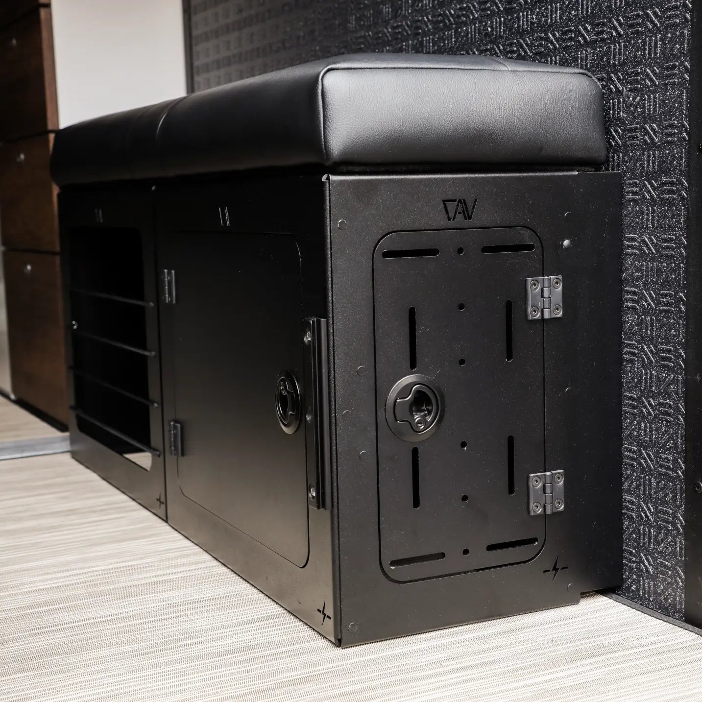 GLSS Passenger PRO bench by CAV in a Storyteller Overland van interior with black cushion and storage compartments
