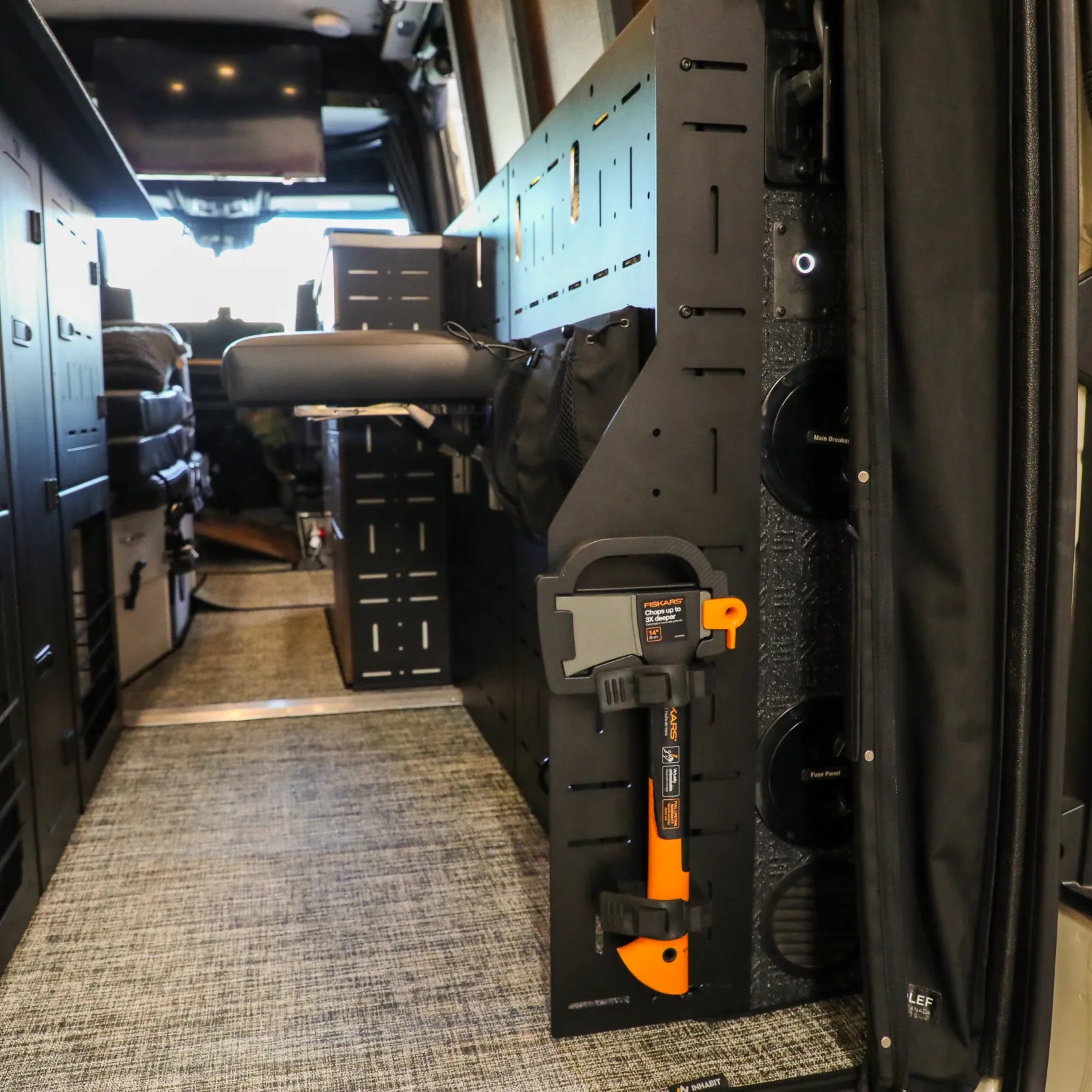 Passenger Gear Wall Pro by Storyteller Overland mounted in van interior with mounted tools and storage compartments