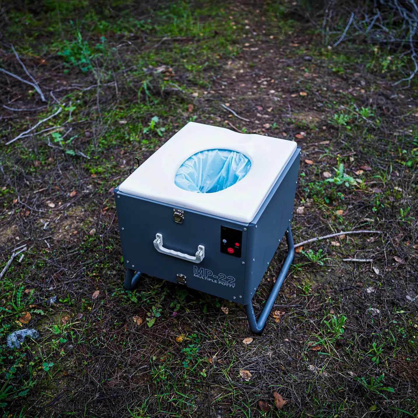 Automatic mobile toilet with handle and compact design, shown in a side view.