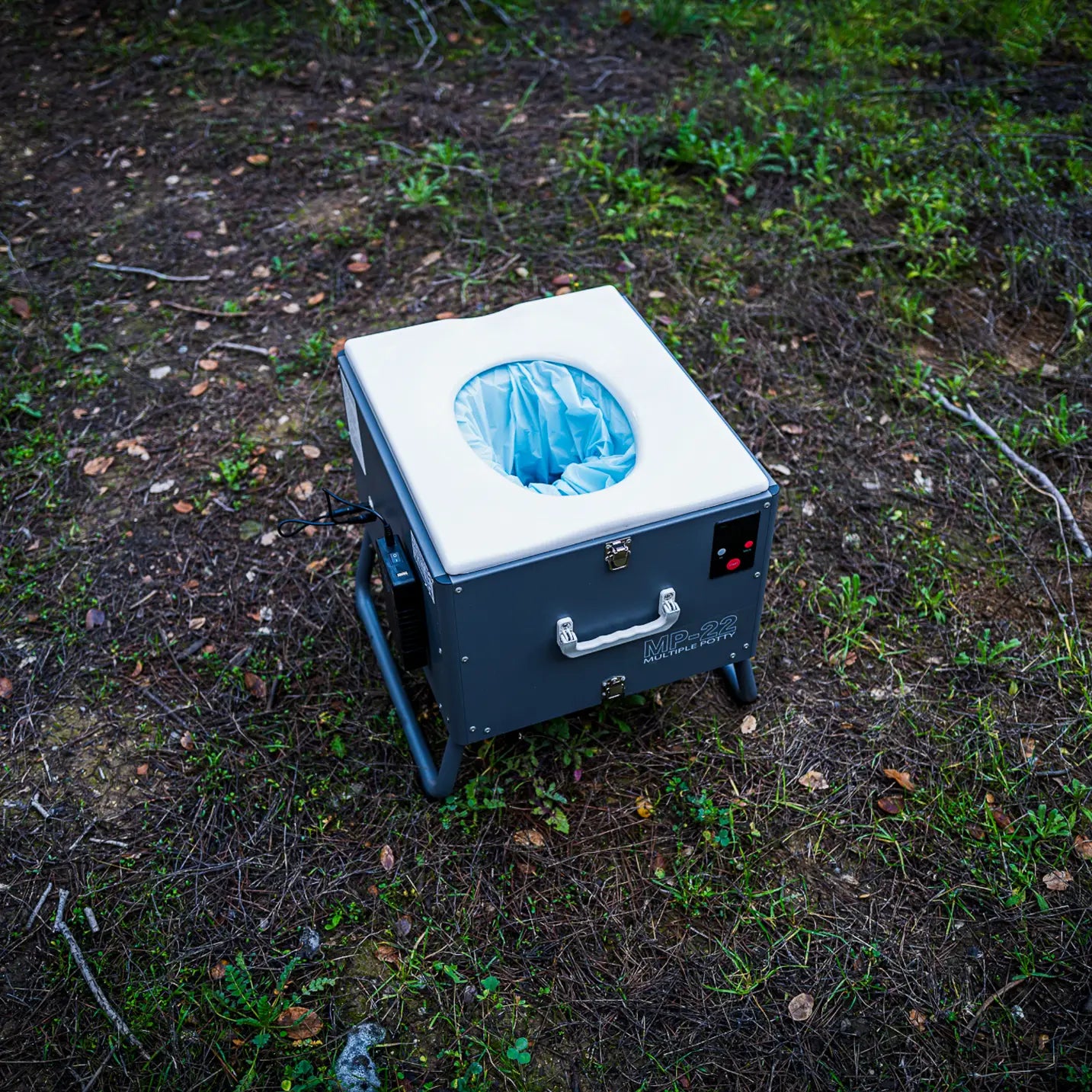 Front view of the GoBoxe automatic mobile toilet with handle and compact design