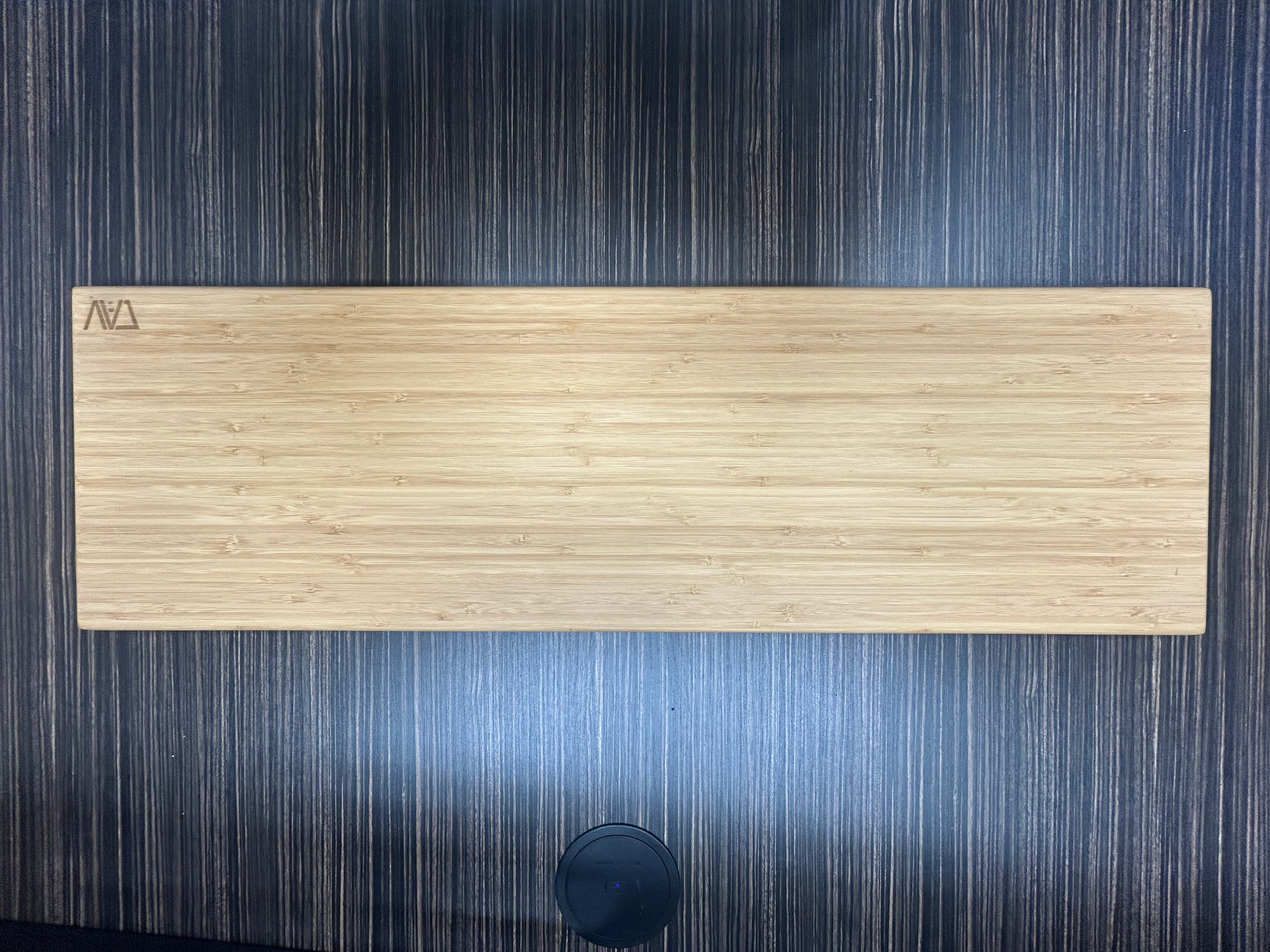 Large Revel adjustable bamboo shelf on dark wood surface