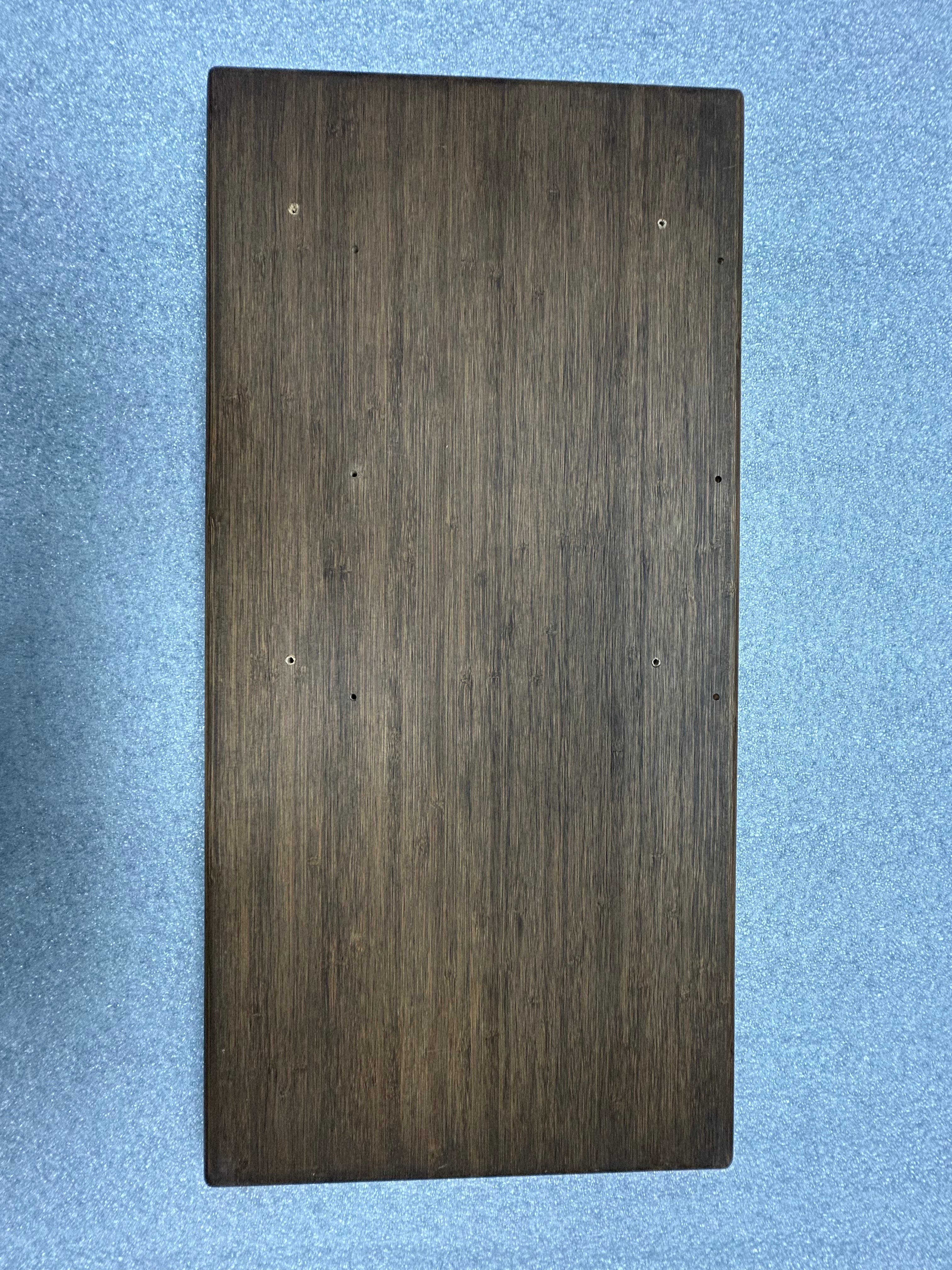 Wood grain small tabletop for van, no threaded inserts, displayed on blue surface