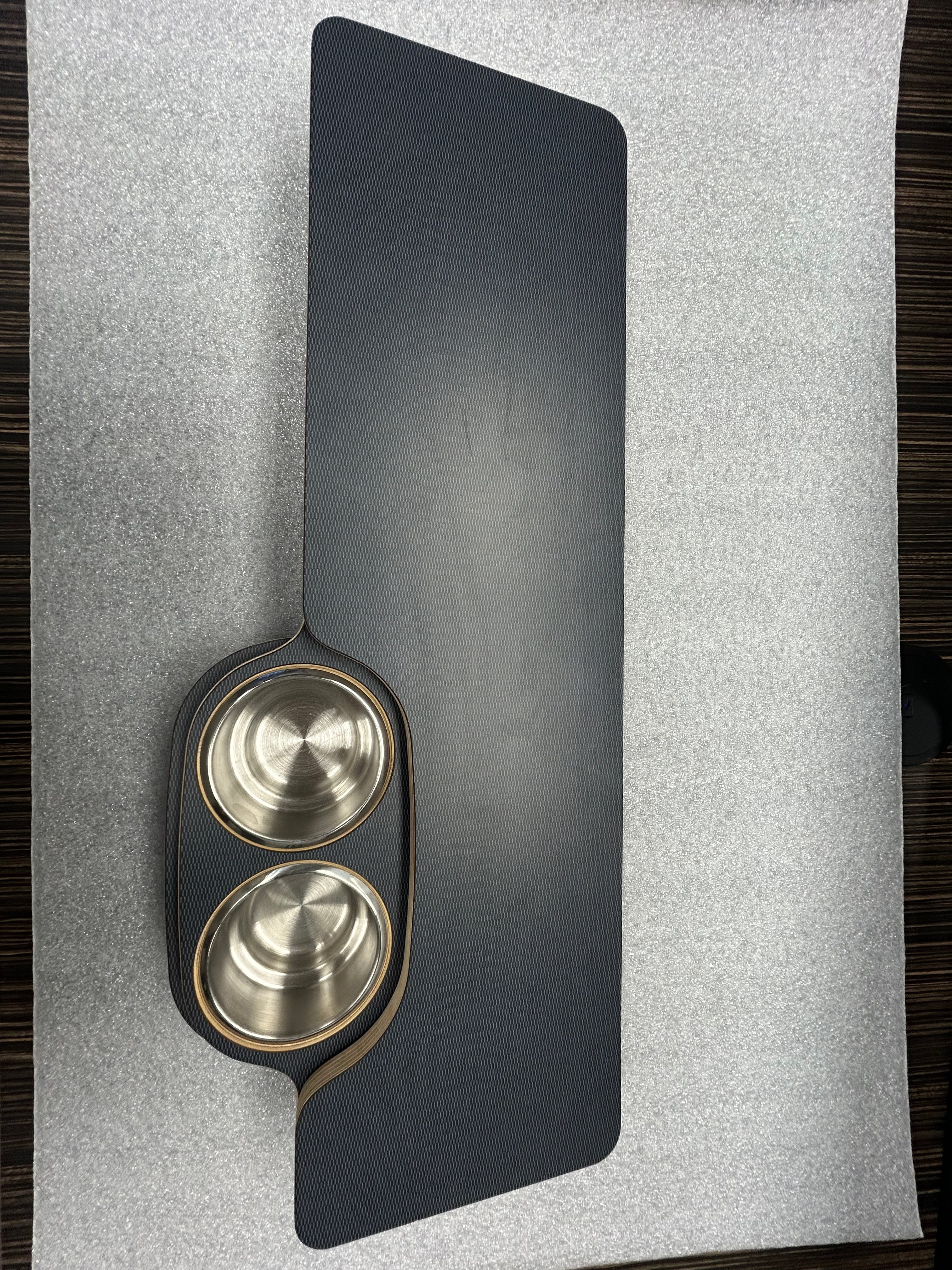 Revel Skinny 2.0 folding table top with dual stainless steel cup holders on textured surface