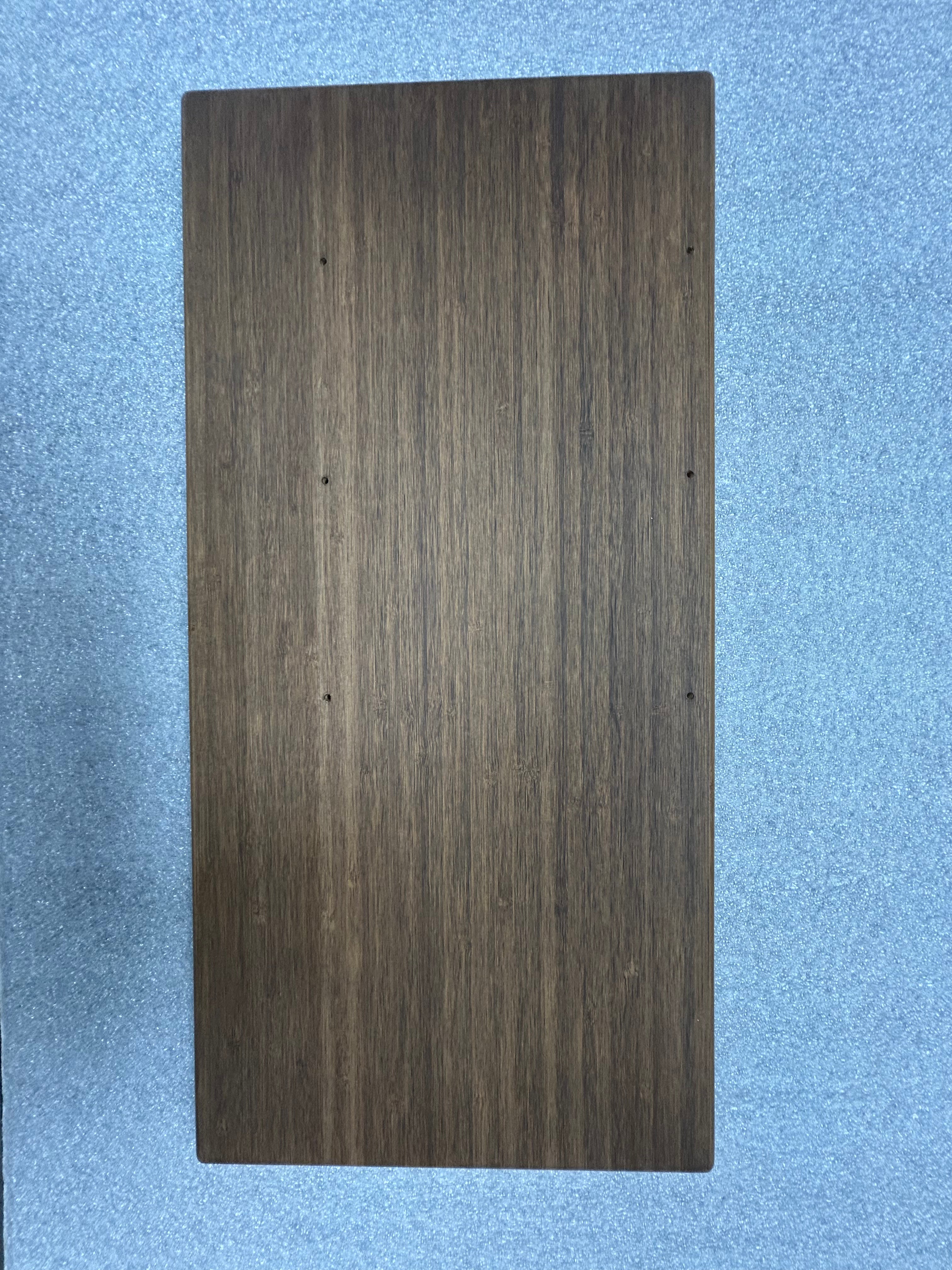 Small rectangular tabletop with a dark wood grain finish, shown on a flat surface.