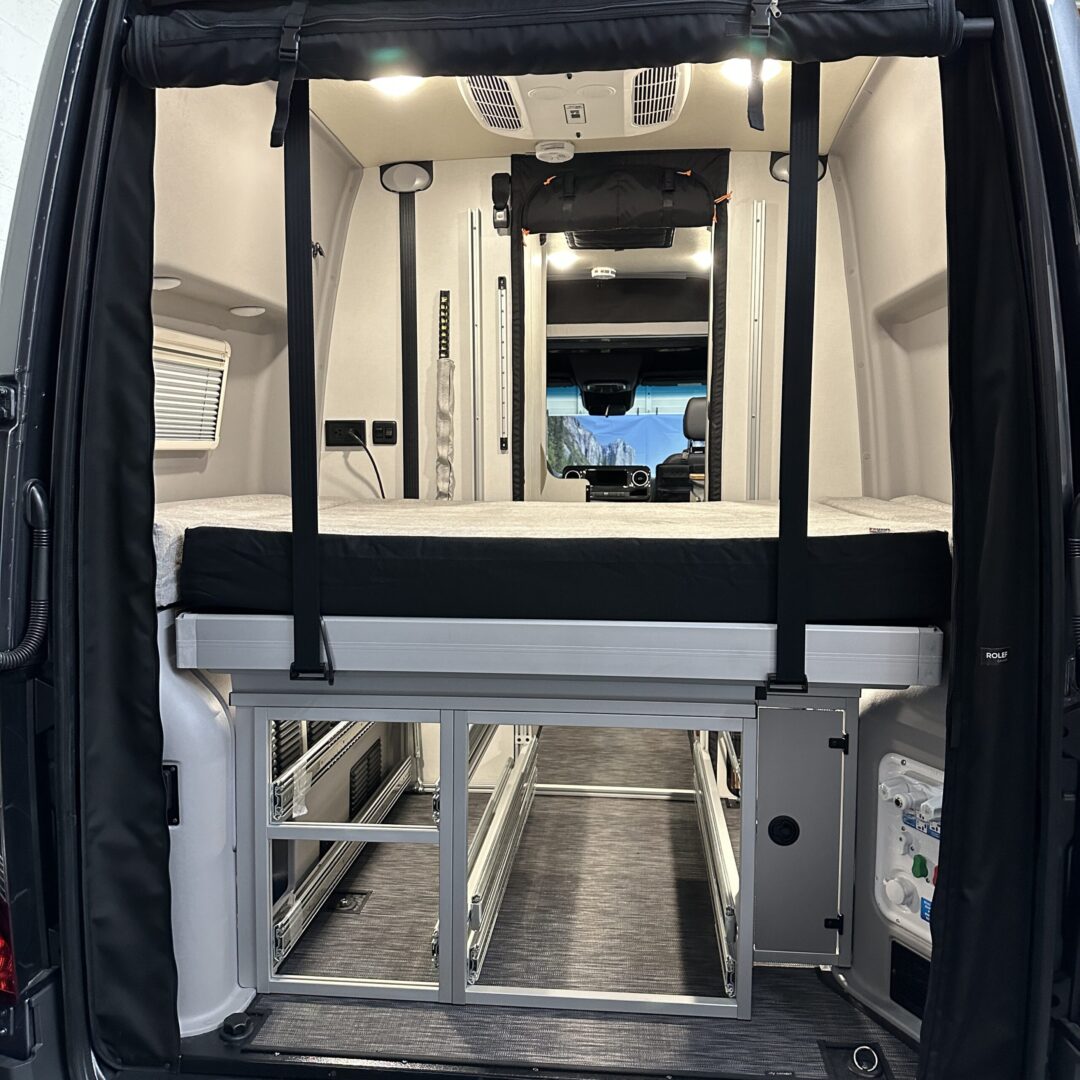 A van outfitted with a Luxe6 Cool Gel Memory Foam 6" Mattress - Made for the REVEL/TERRAIN/LAUNCH for comfortable rest on the go.