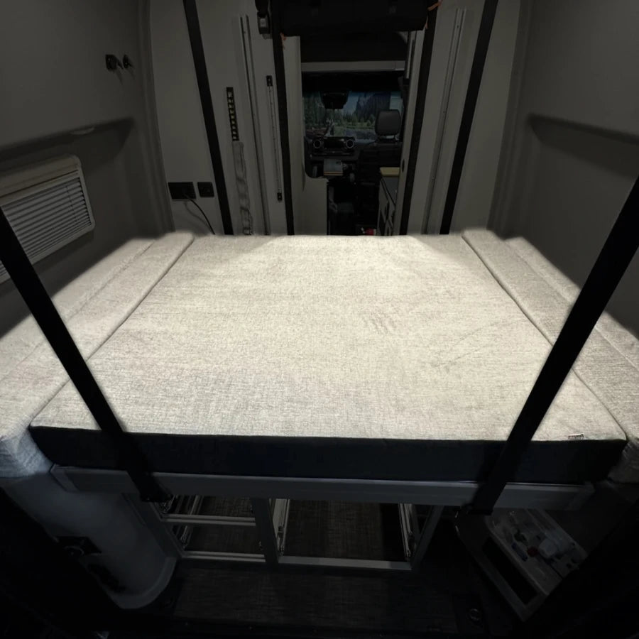 Luxe6 Memory Foam 6 Mattress set up in the rear sleeping area of a van interior.
