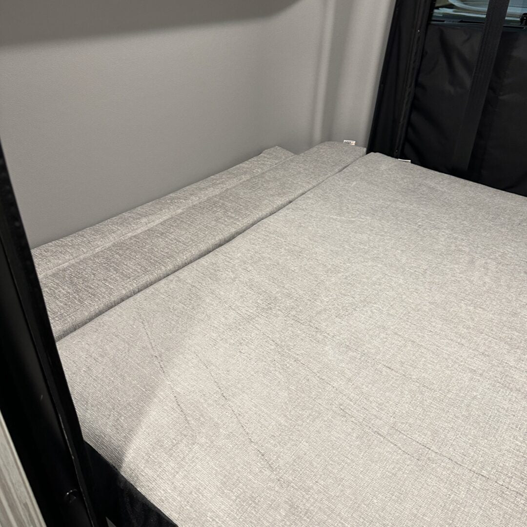 Luxe6 memory foam 6-inch mattress set up flat inside a van sleeping area.