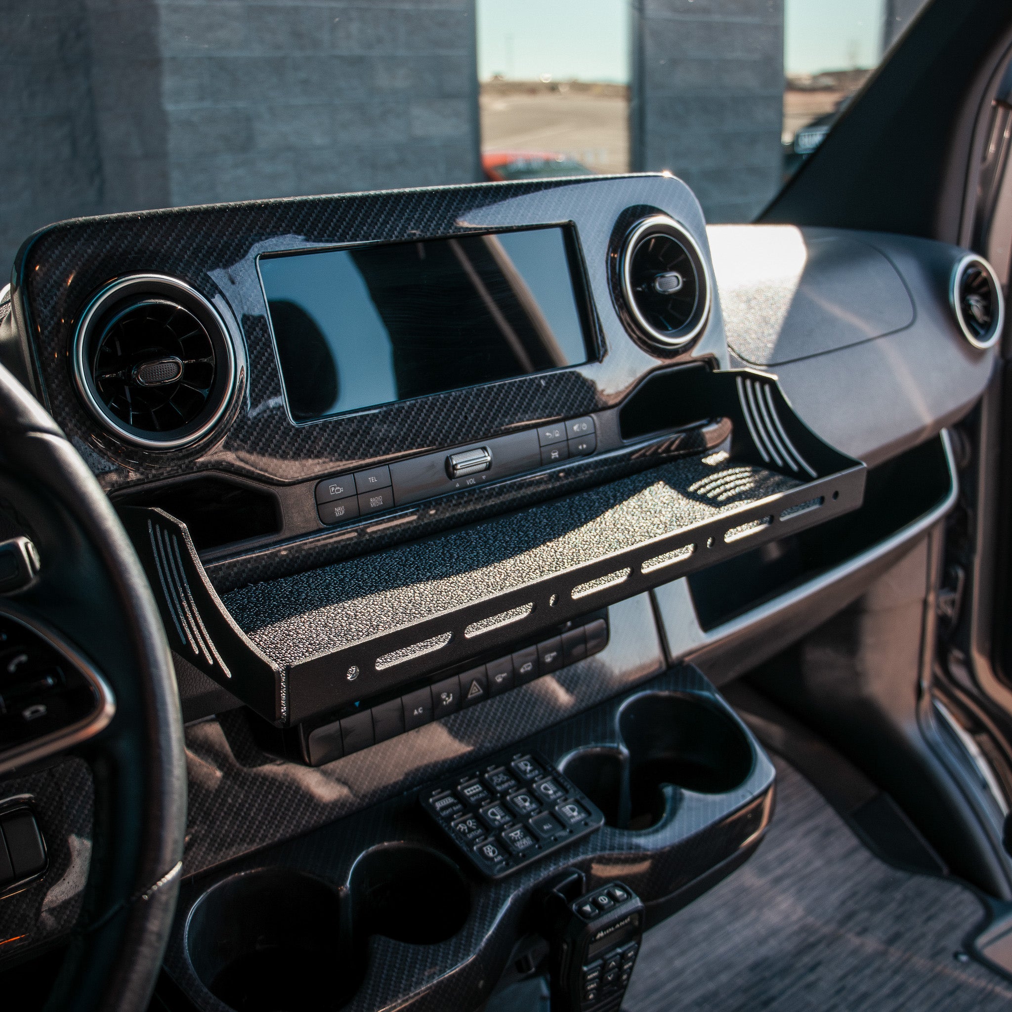 CAV D-ash Tray Pro installed in van dashboard with textured black finish and storage compartments.