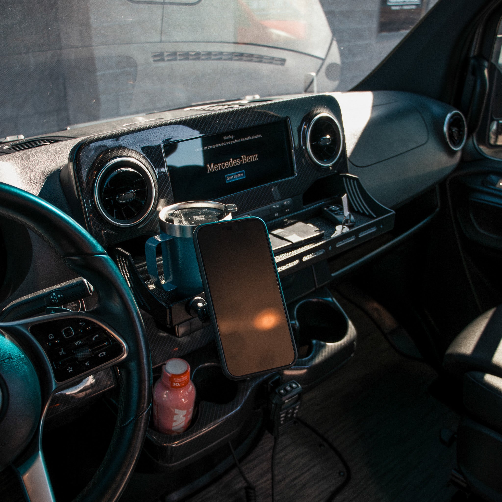 CAV D-ash Tray Pro installed in van cockpit with mounted phone and drink holder.