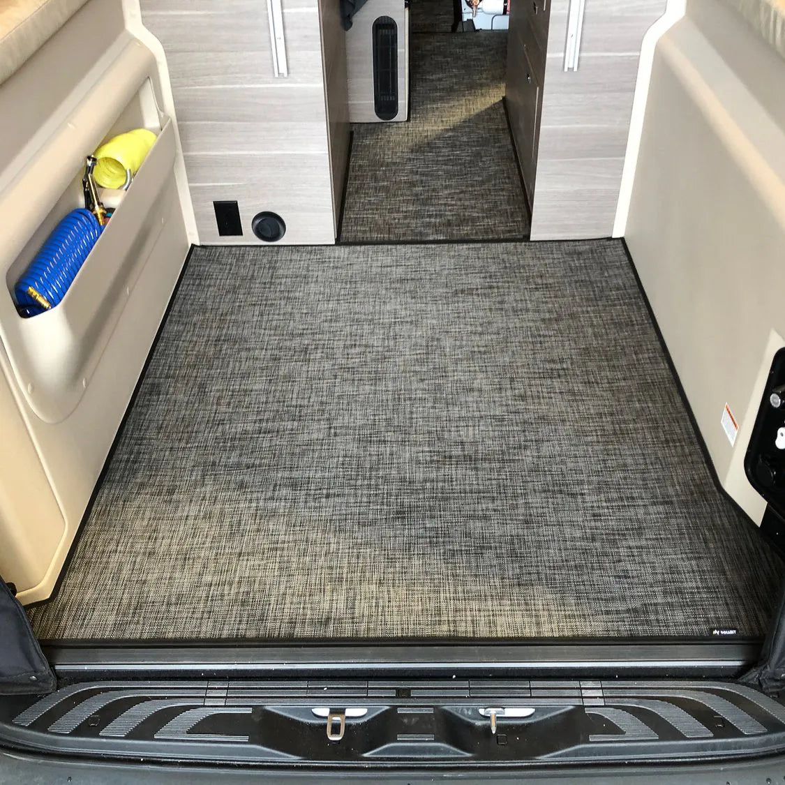 Inhabit floor mat system for Jayco Terrain and Entegra Launch, shown installed inside a vehicle