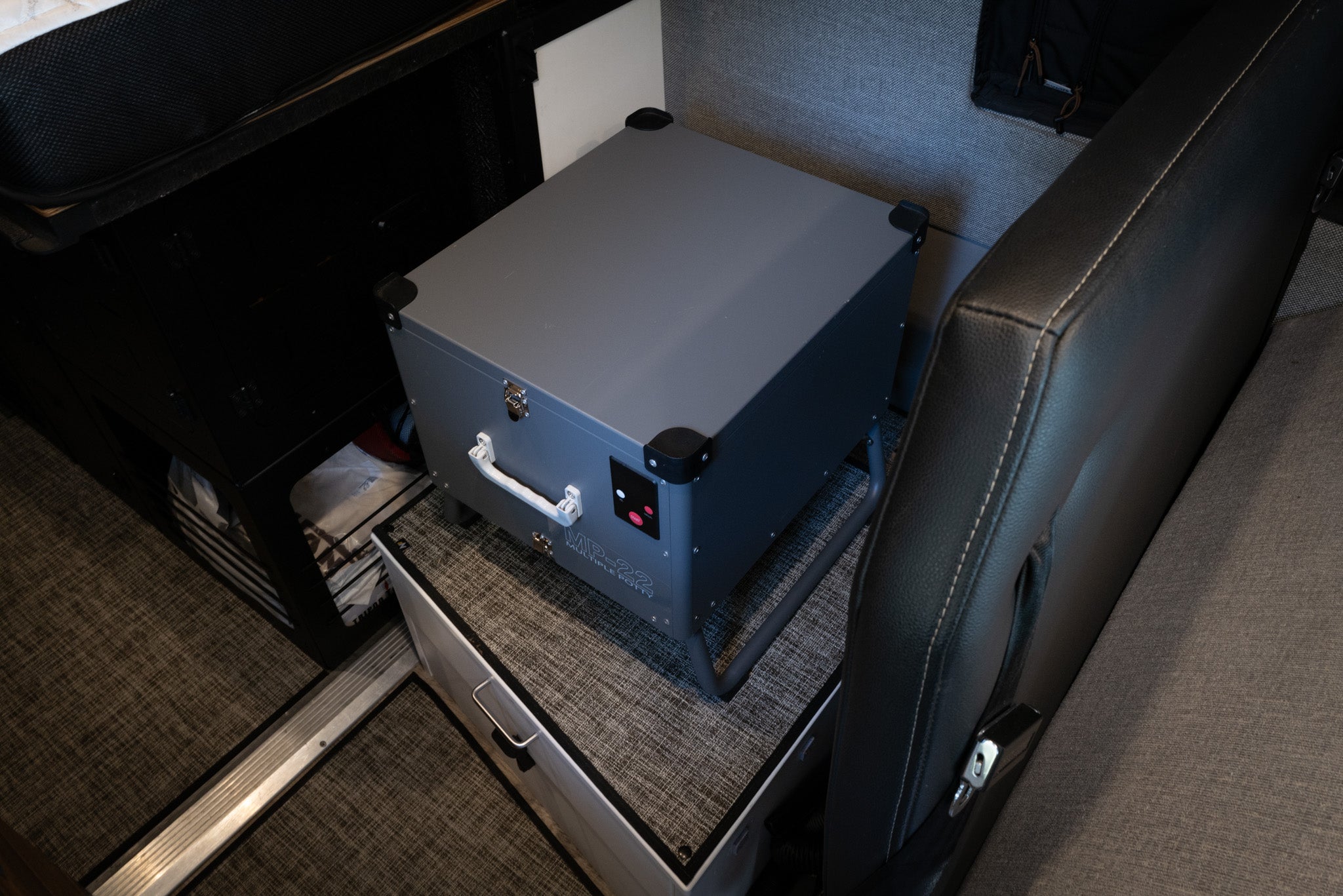 Portable automatic mobile toilet with handle and compact design for easy transportation.
