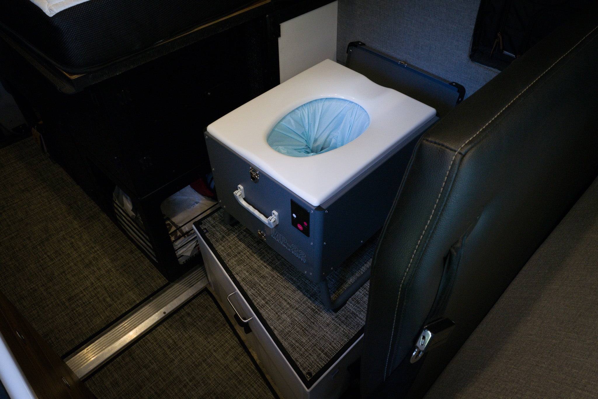 Mobile automatic toilet with handle and compact design, suitable for on-the-go use.