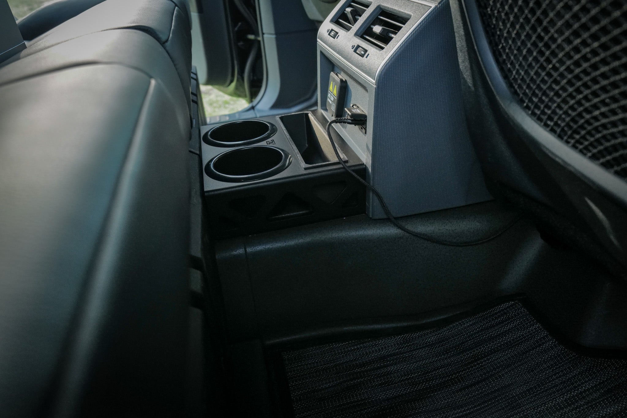 INEOS Grenadier Cup Holder and Phone Storage behind center console