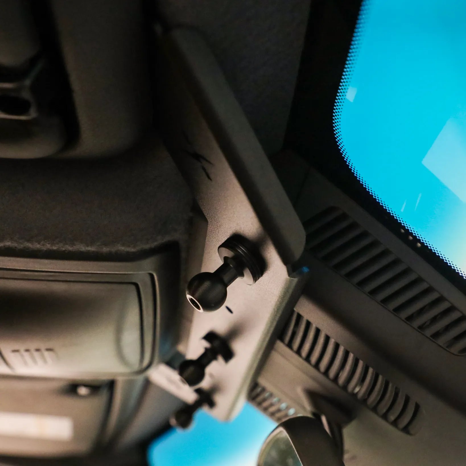 NAV-Mount mounting system by CAV installed on van ceiling above driver area