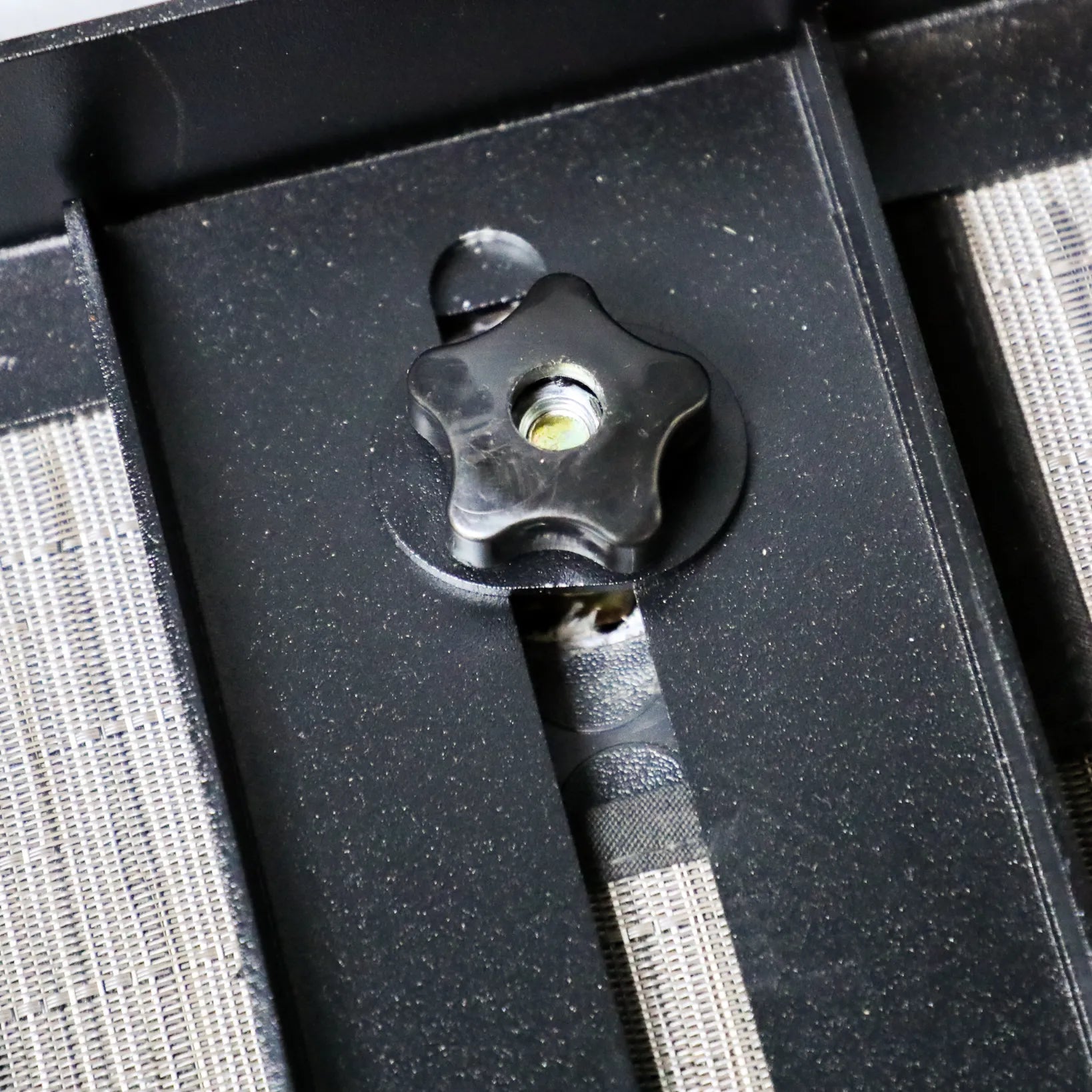 Close-up of the GLSS Driver PRO drawer system adjustment knob in a Revel van storage setup
