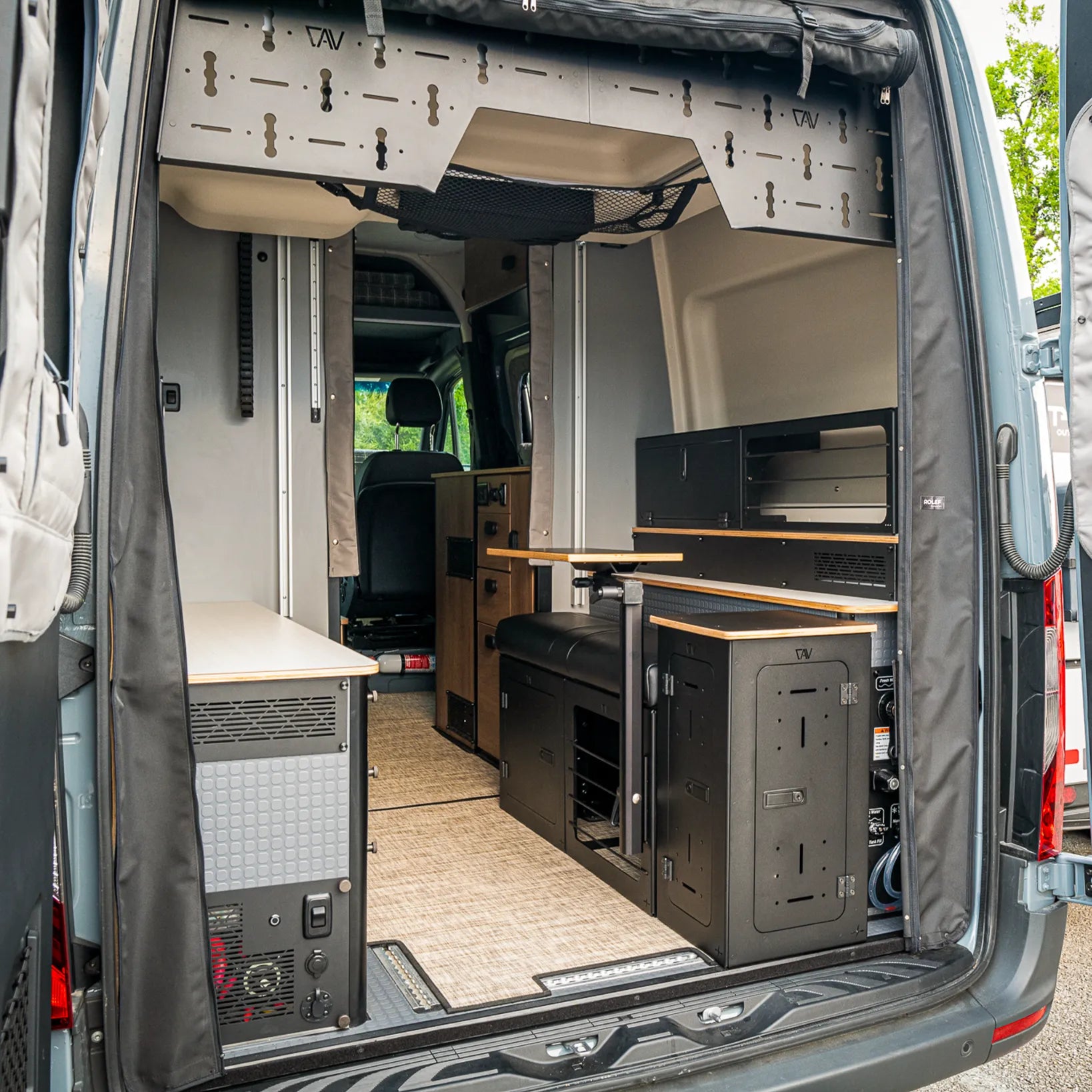 Revel van interior with GLSS Passenger PRO seat and H2O box installed in rear cabin space