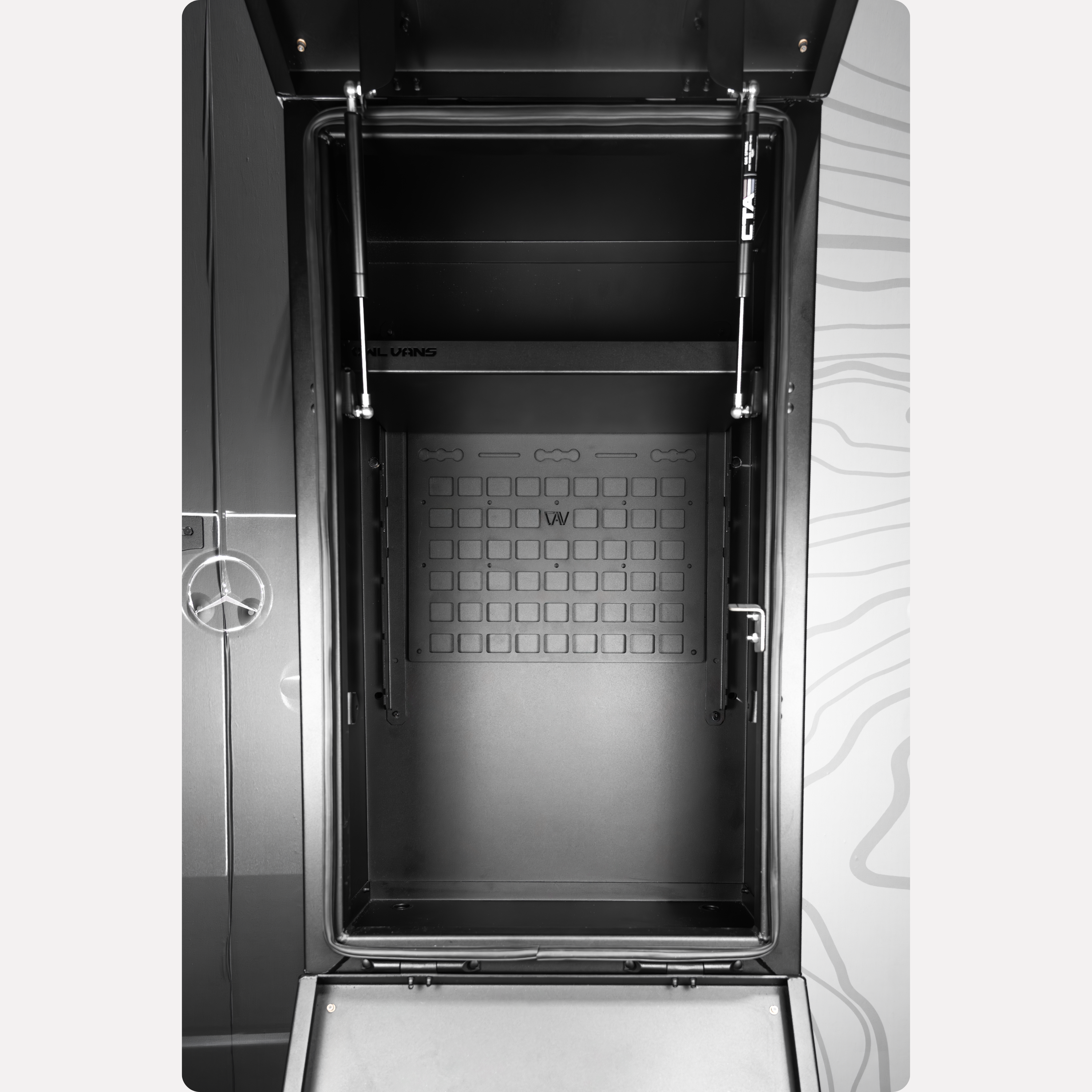 Owl Vans rear storage box Molly panel mounted on van door interior, open to reveal storage space.