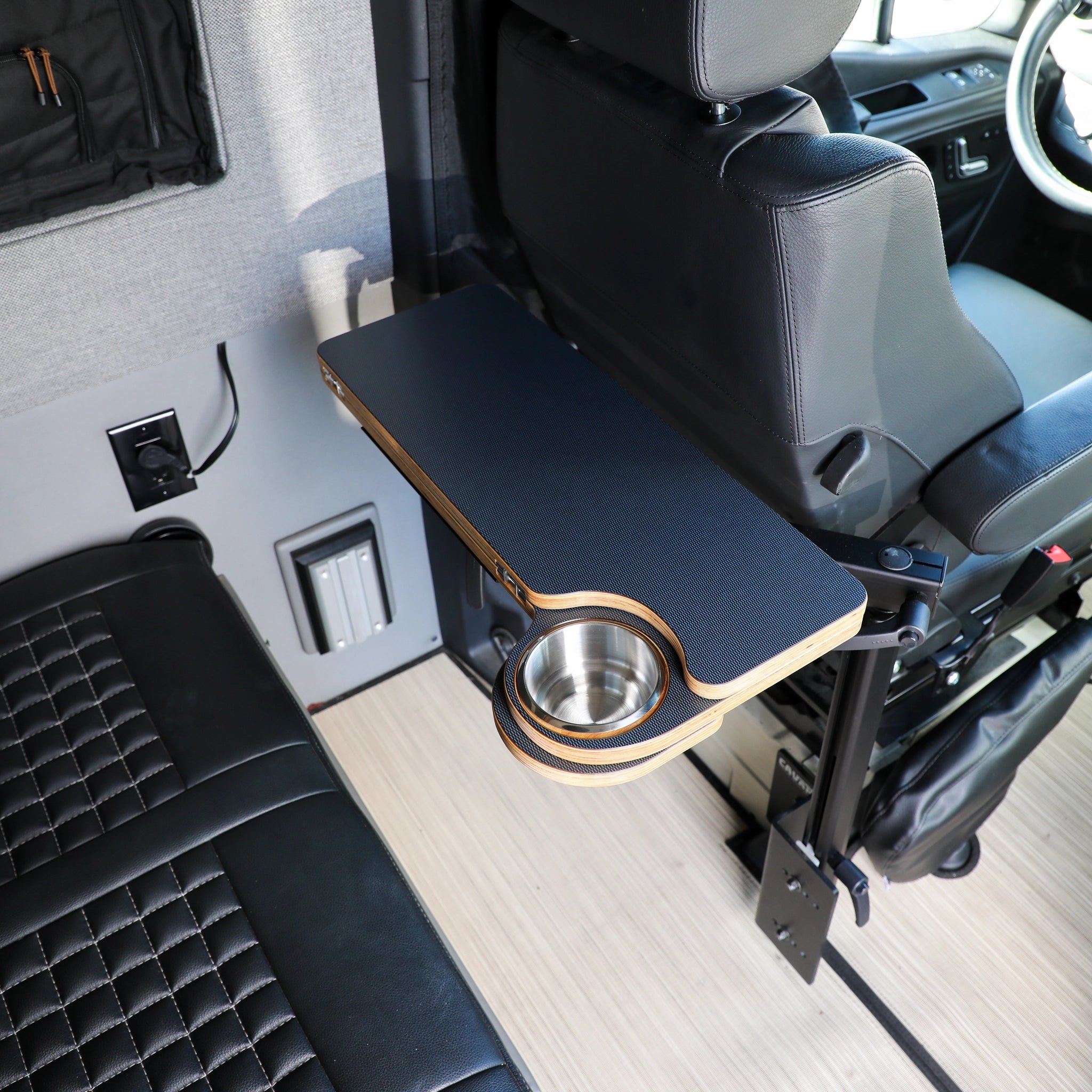Solo Folding Table Top with built-in cup holder mounted behind driver seat in van interior