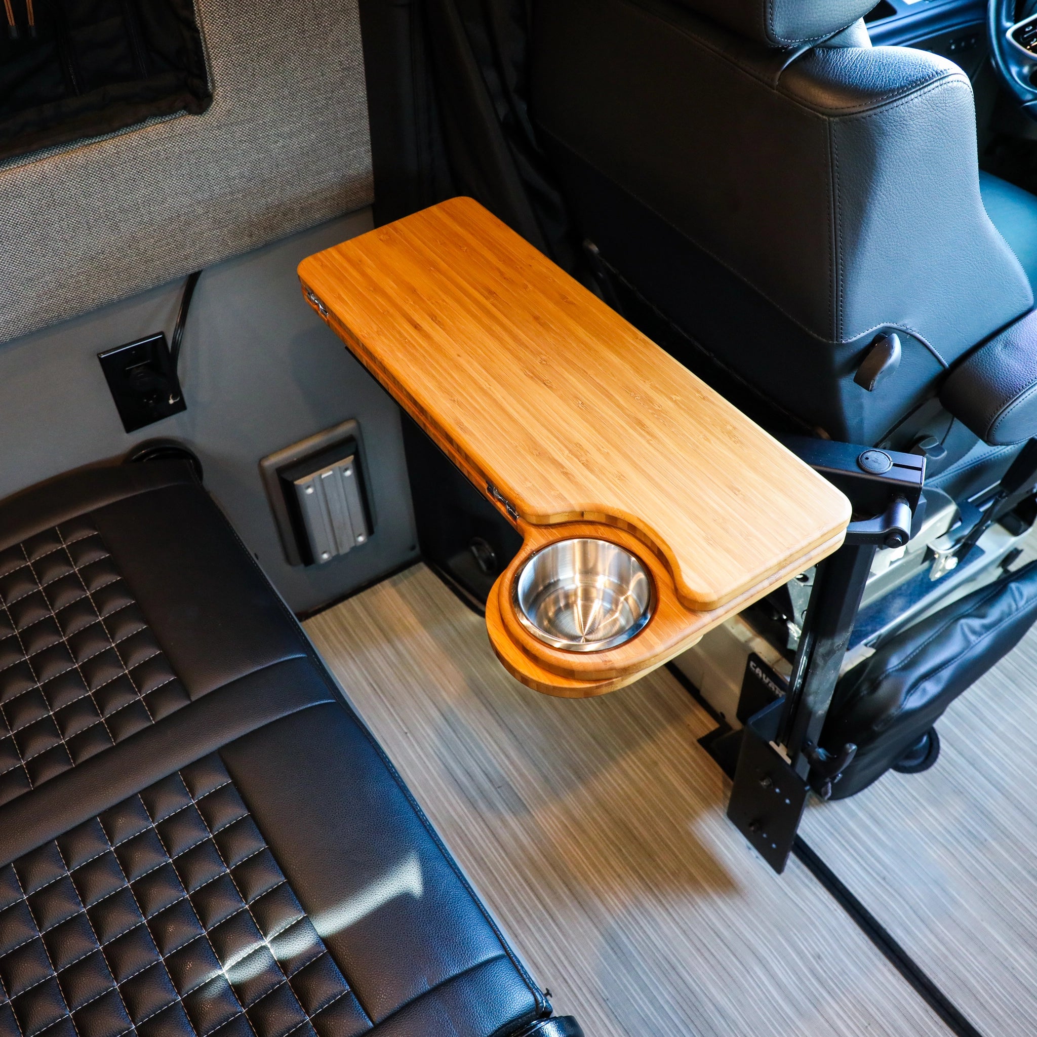 Solo Folding Table Top by CAV mounted beside a van seat with built-in cup holder