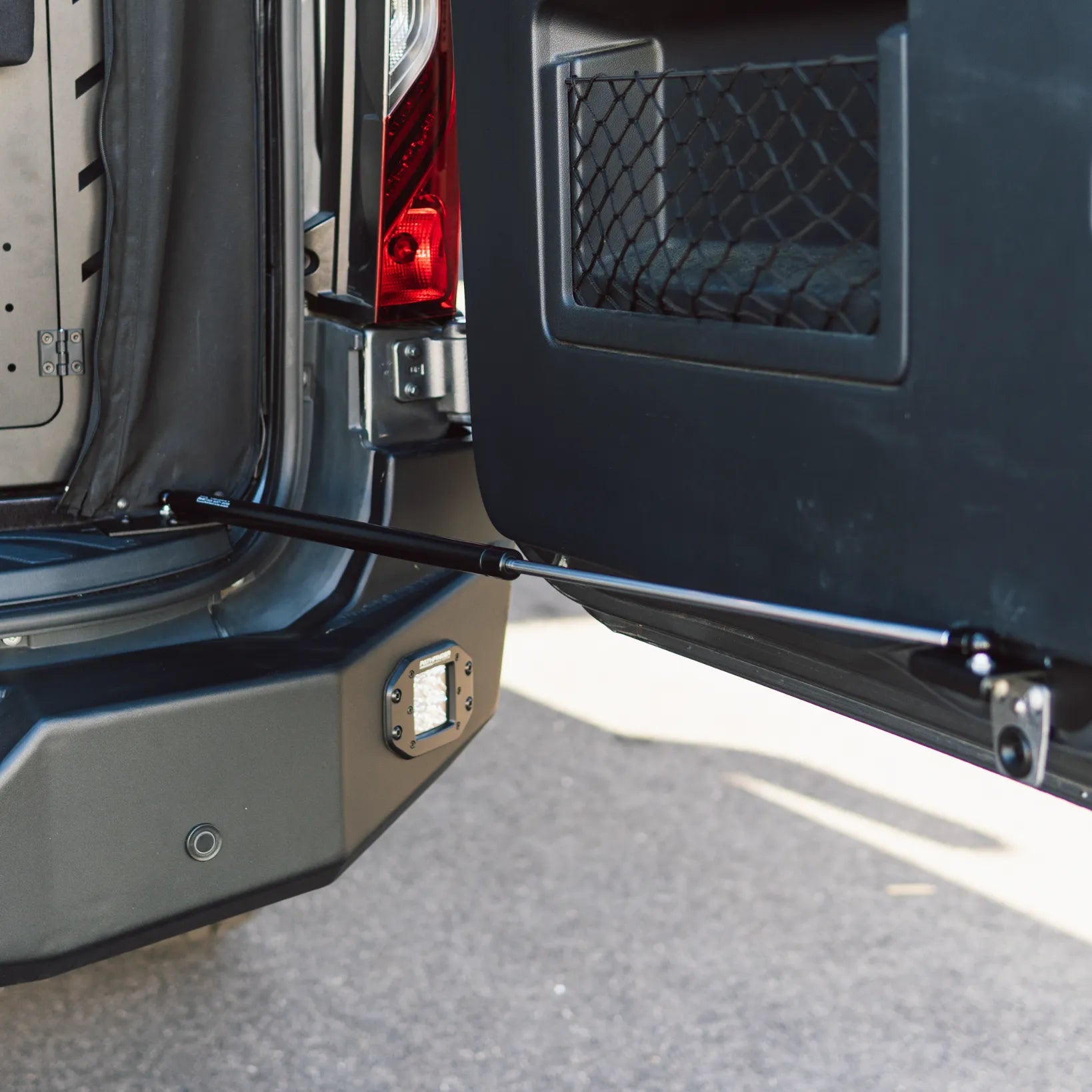 Close-up of rear door strut in a Revel van from the Ultimate Revel Bundle