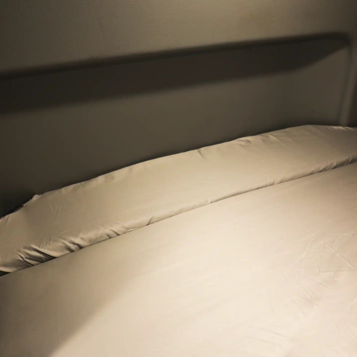 Revel Ultra Luxe Dream Sheets neatly spread on a van bed with a neutral wall backdrop