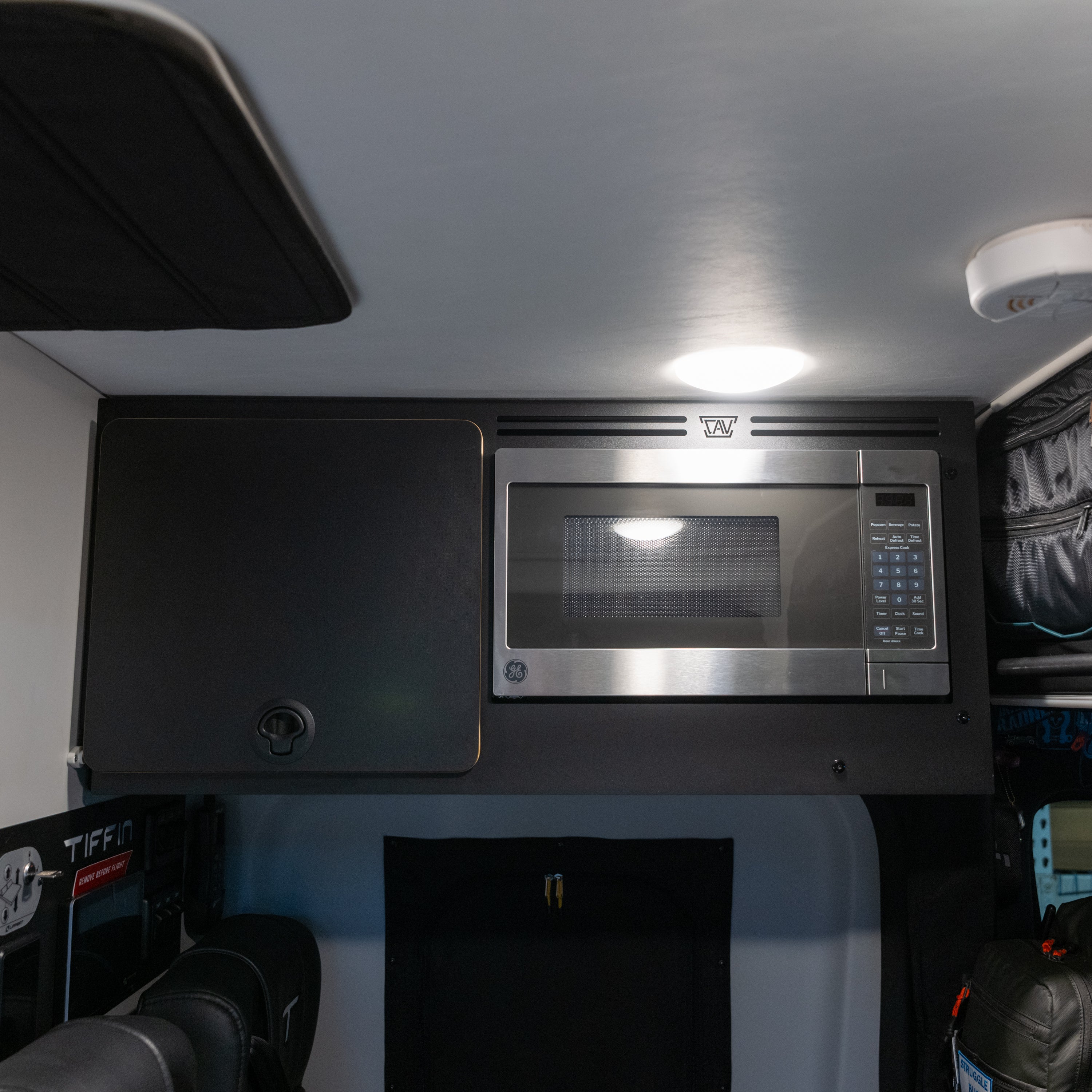 Tiffin GH1 microwave kit with GE microwave installed in upper van cabinet