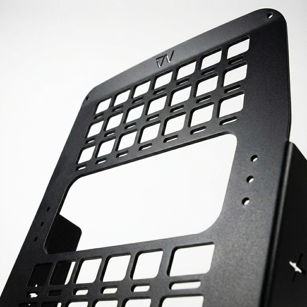 Close-up of black CAV Seat Backpack metal panel with cutout grid design.