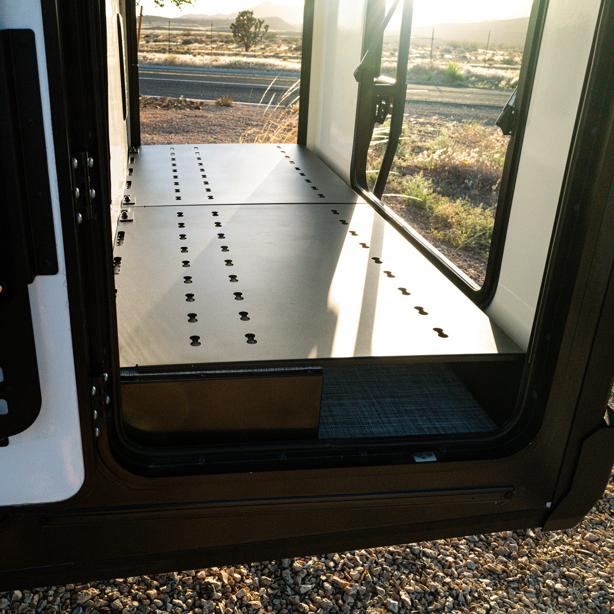 canyon ekko garage platform installed in winnebago ekko mercedes sprinter van for storage shows with doors open