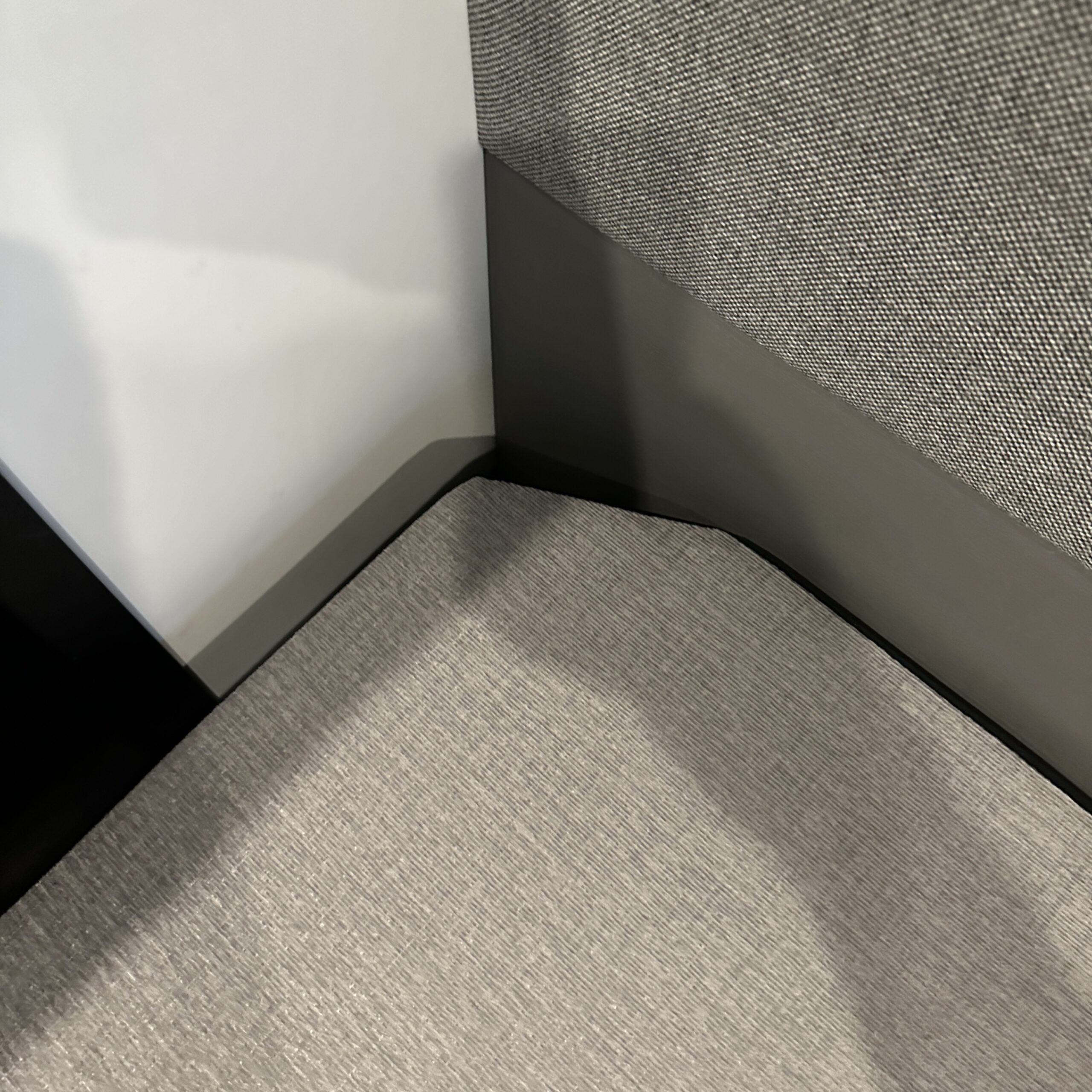Close-up of Groove Lounge Mattress Topper fitted in a Storyteller van corner seating area.