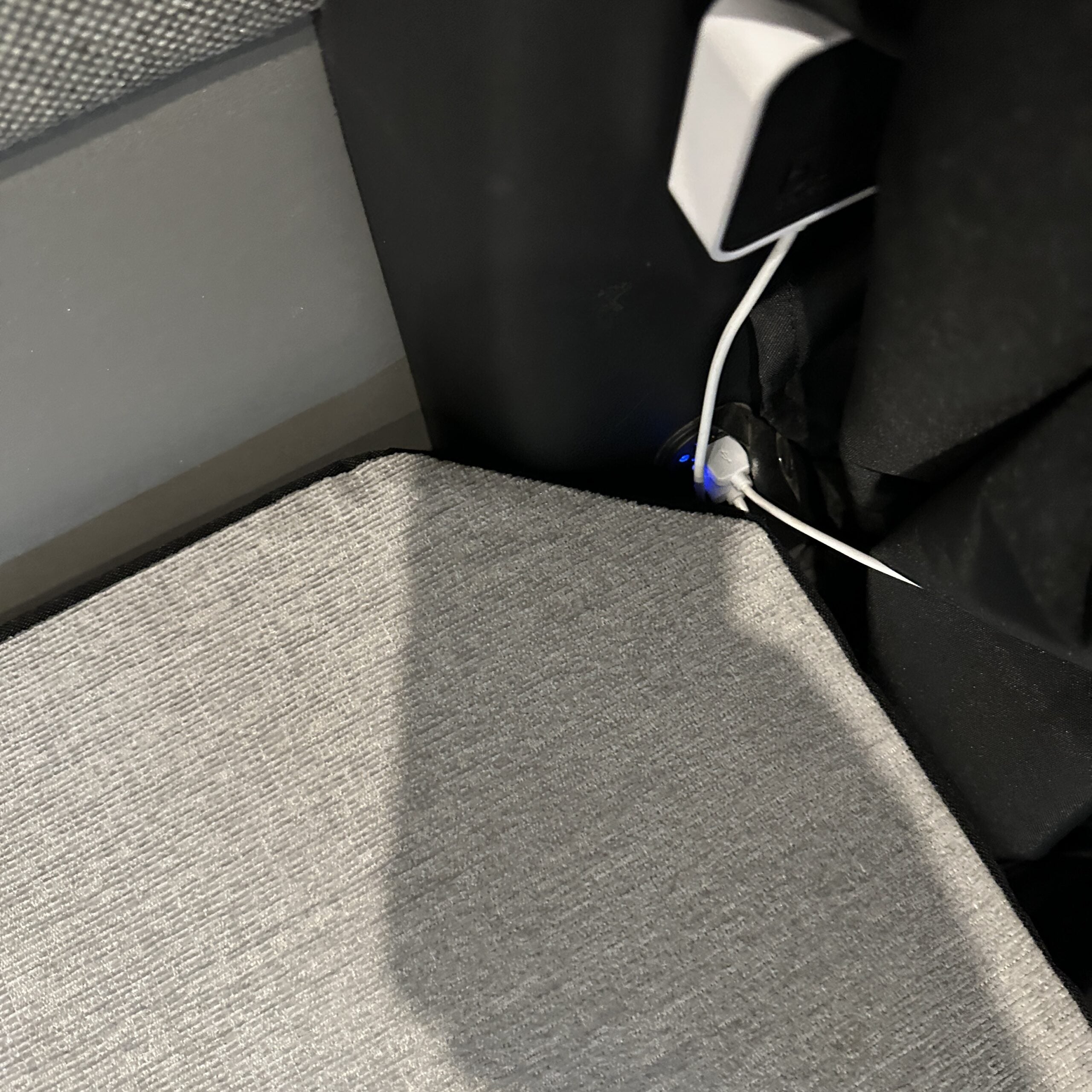 Groove Lounge Mattress Topper fitted on van seating with charging cable nearby