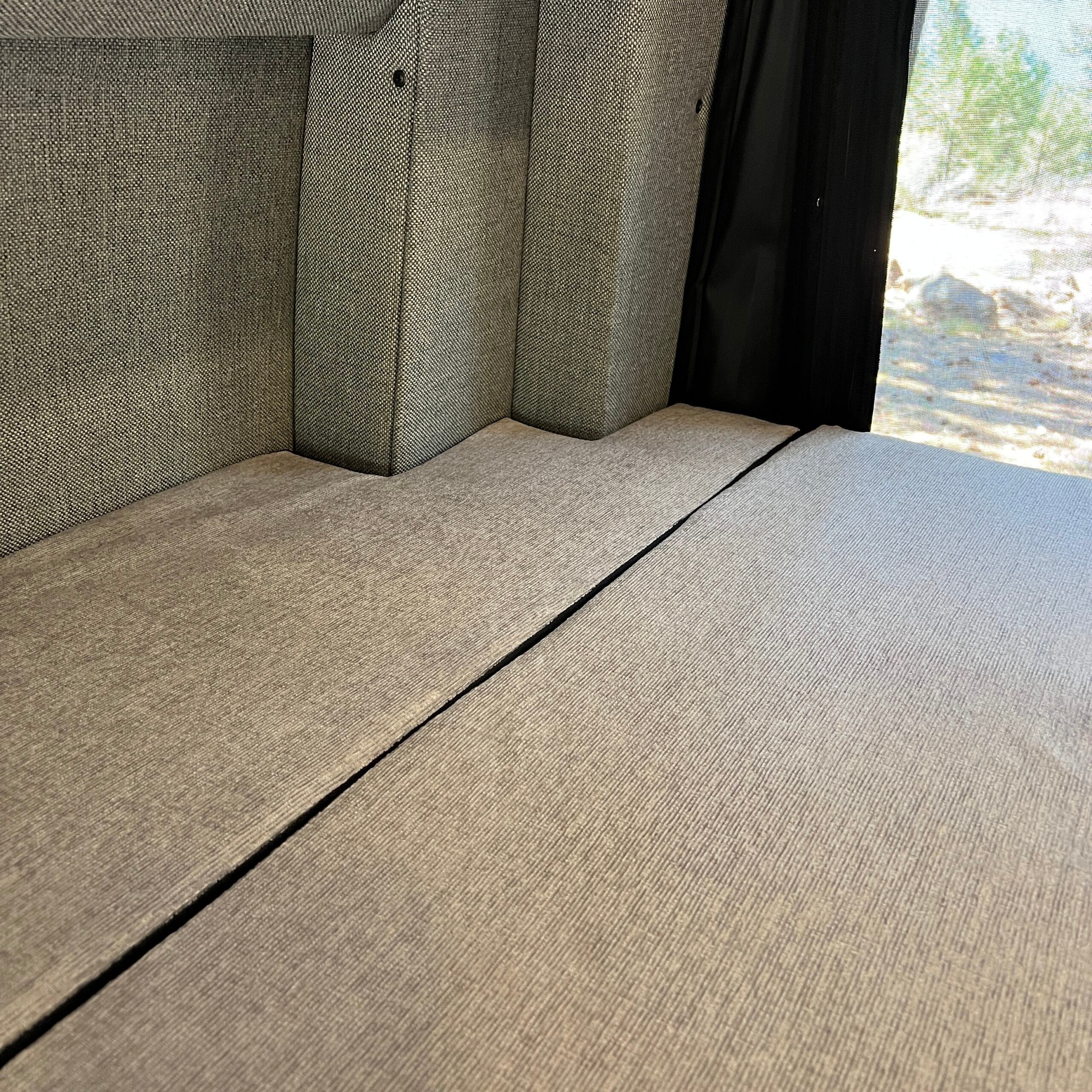 Luxe5 Cooling Memory Foam 5-inch mattress laid flat inside a Storyteller MODE van interior.